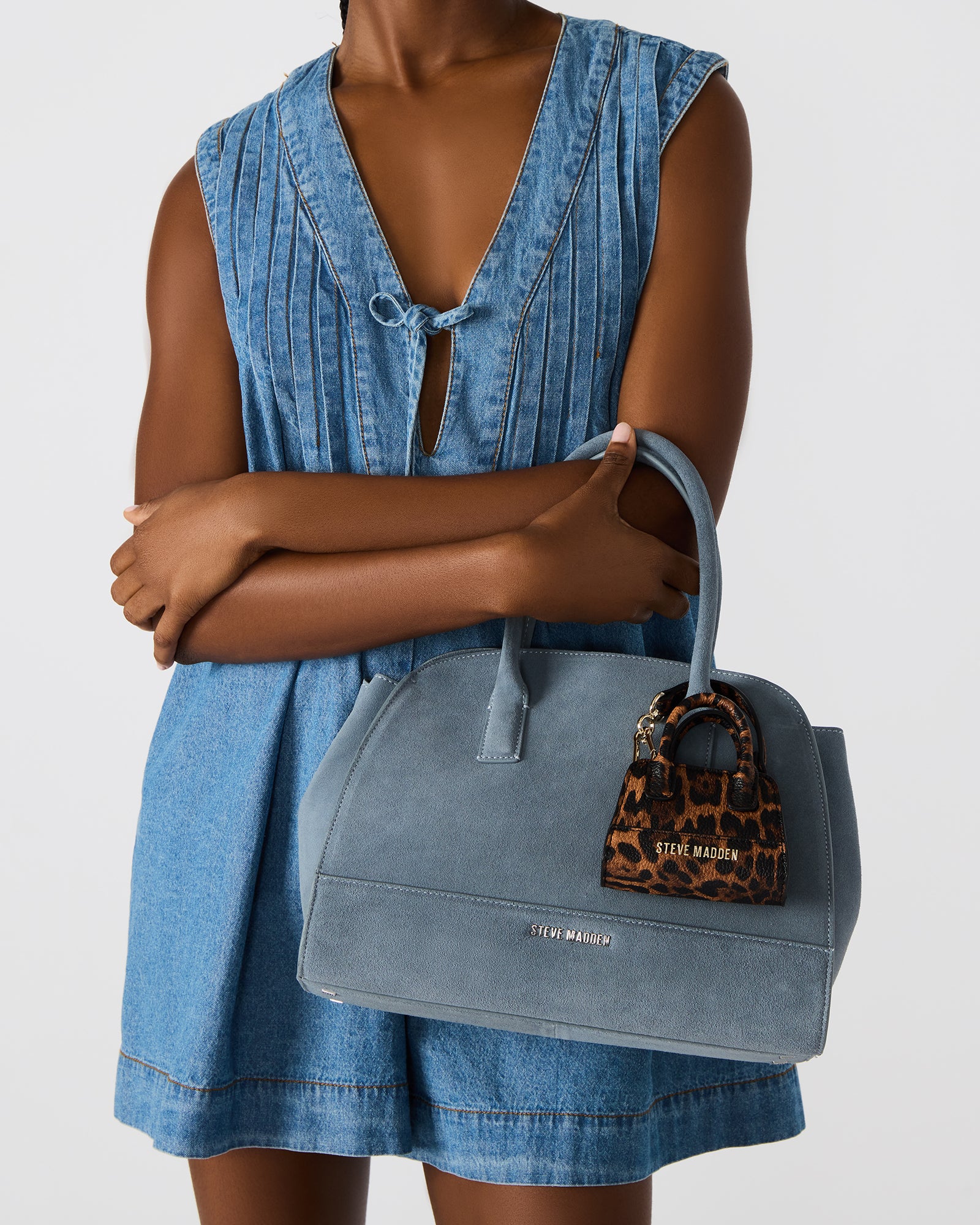 Close-up of the mini charm’s snap closure and textured design