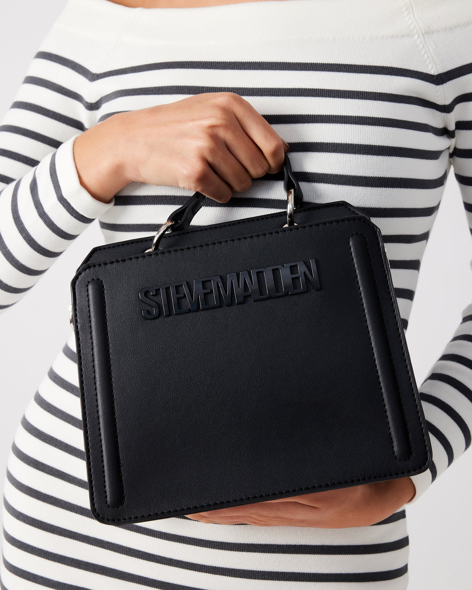 Inside view of the Evelyn bag showing organized compartments and detachable zip pouch
