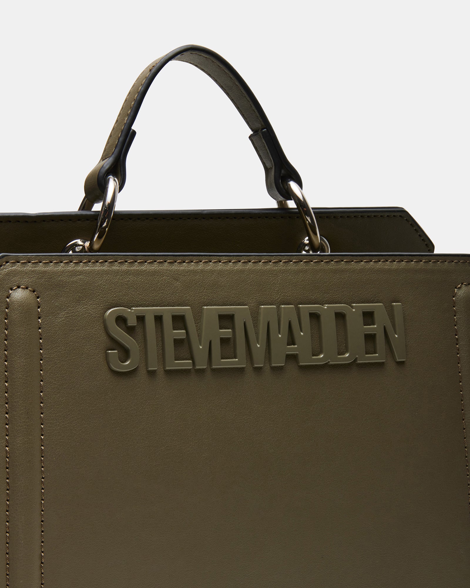 Model wearing the bag as a crossbody, showcasing its versatile urban appeal.