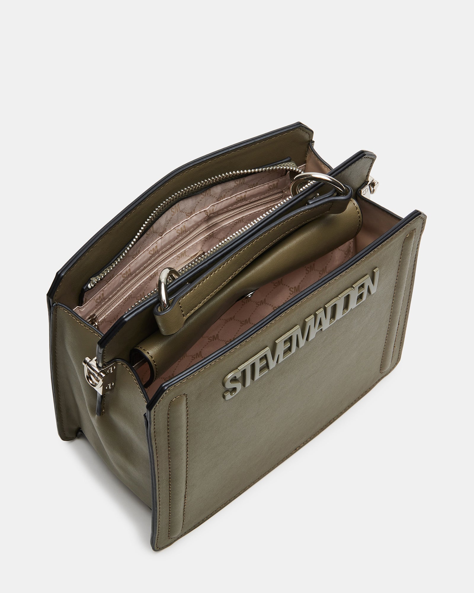 Evelyn grey sage top handle bag shown on a cafe table with essentials neatly organized inside.