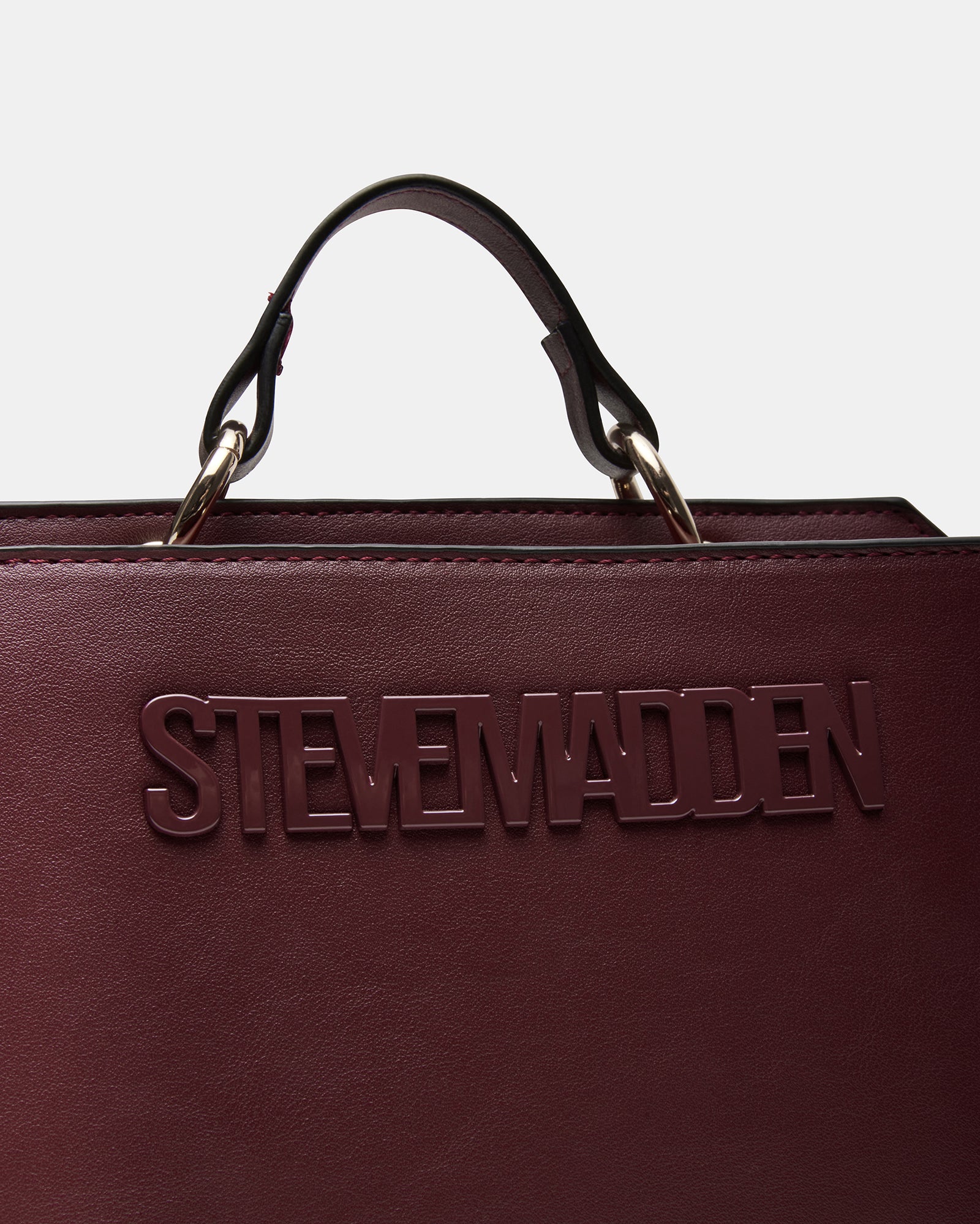 Evelyn Wine bag displayed with detachable crossbody strap for versatile wear.