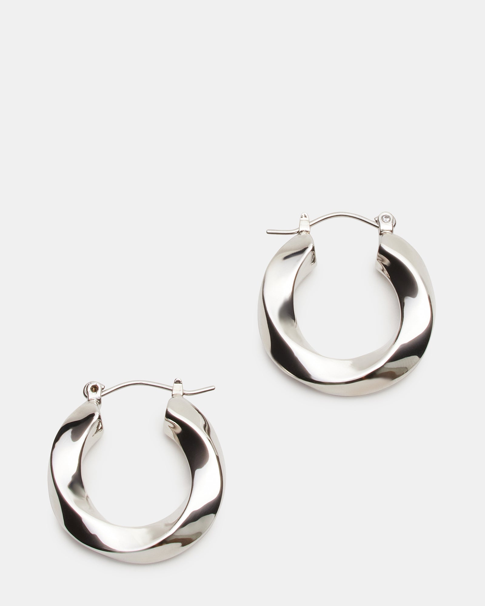 Close-up of sterling silver twisted hoops showing craftsmanship