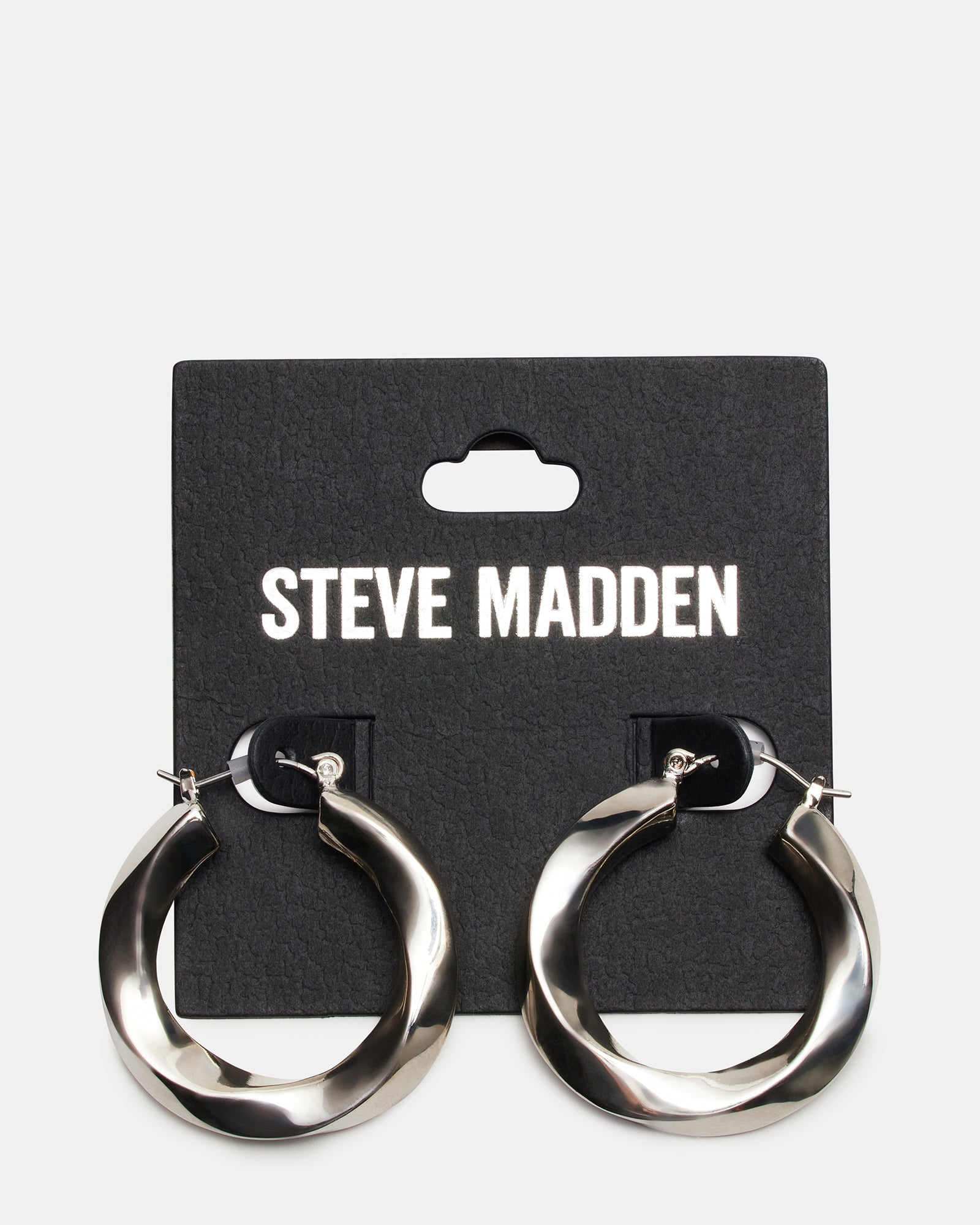 Stylish medium silver hoops worn with casual and formal outfits