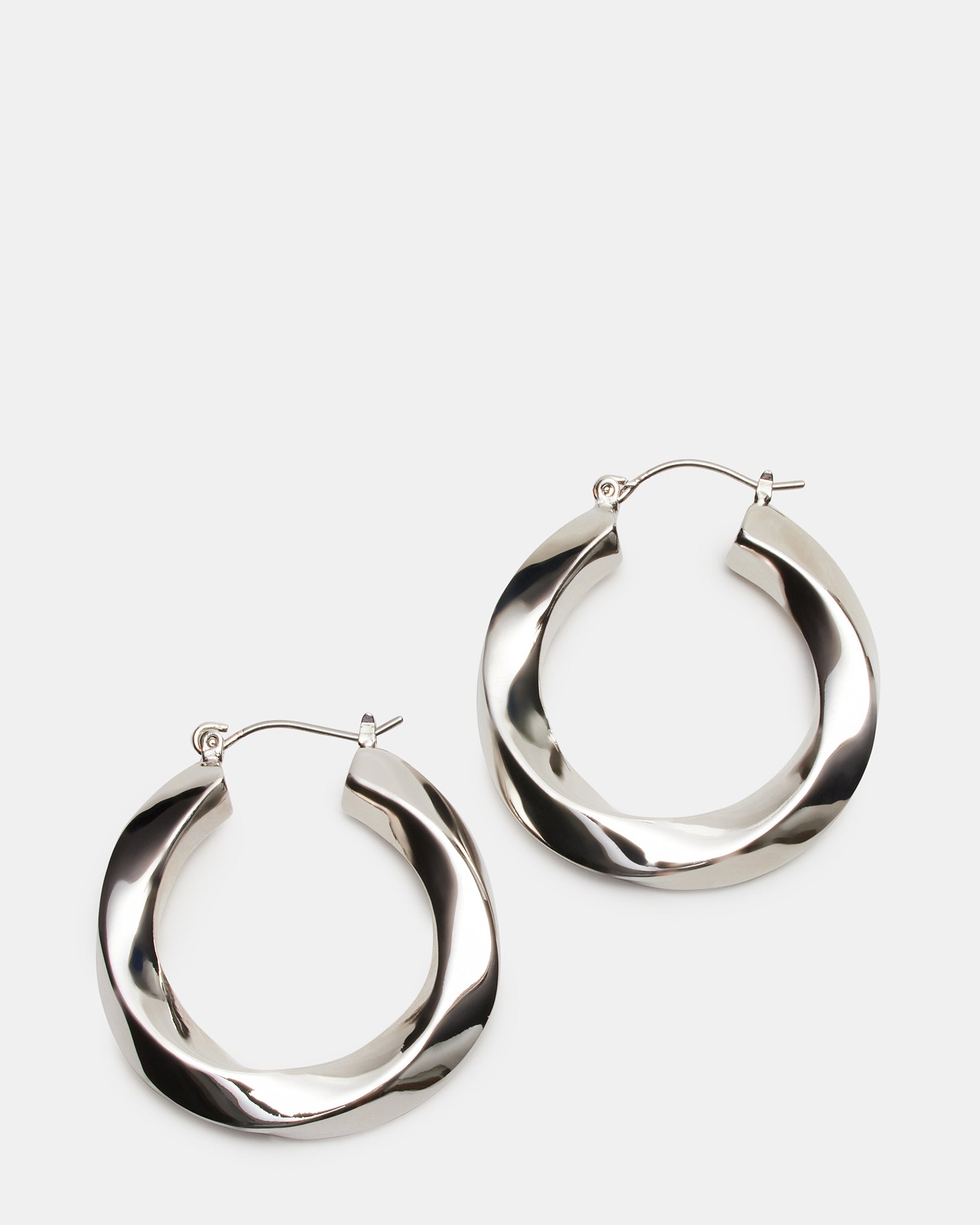 Medium silver twist hoop earrings showing intricate twisted design