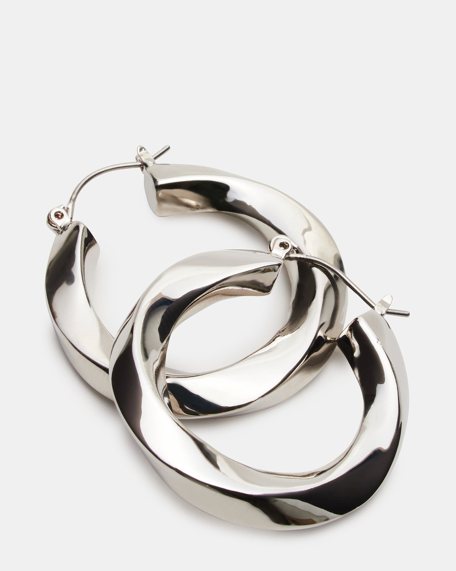 Close-up of silver hoop earrings with hinge closure for women and men