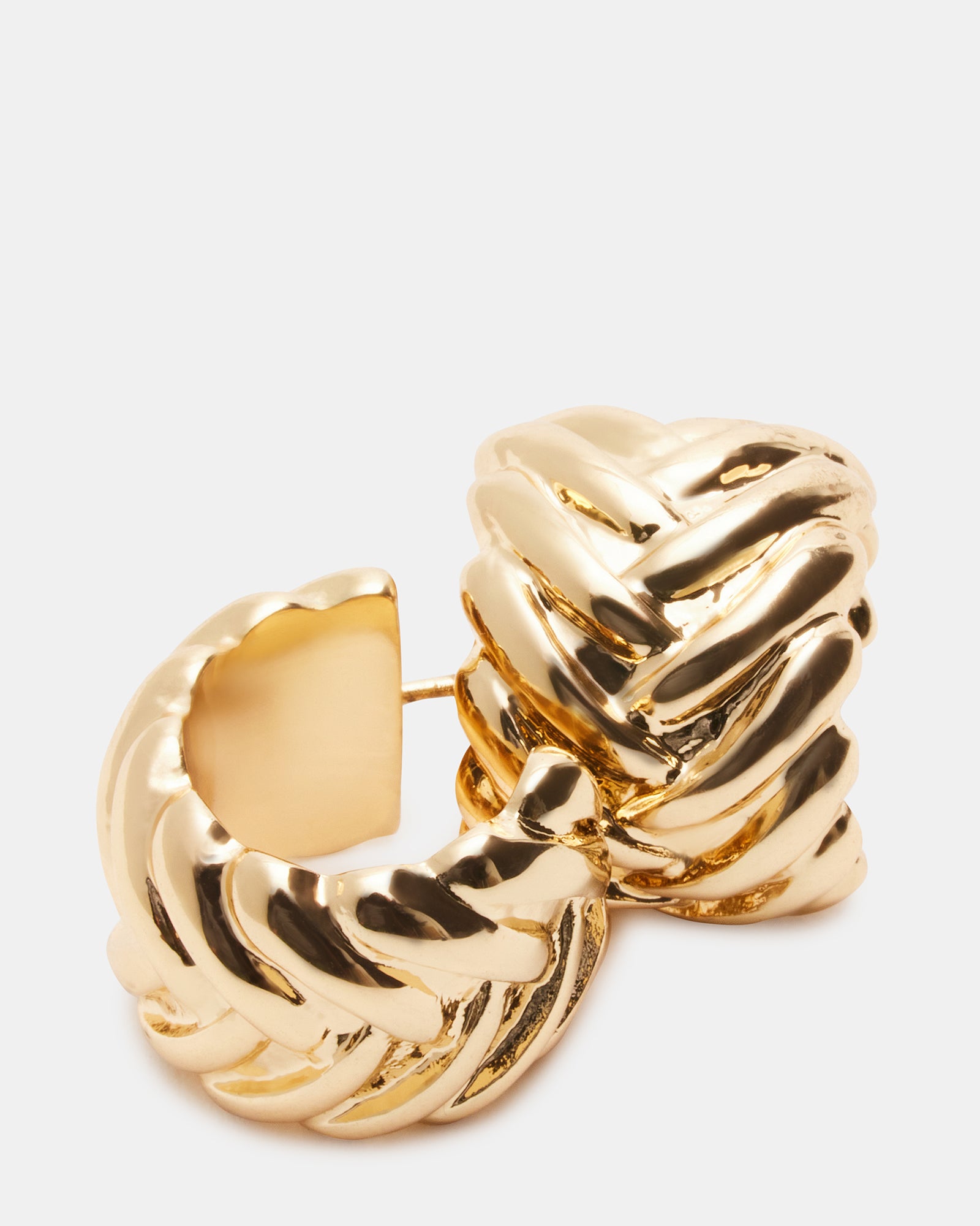 Side view of diamond-accented huggie earrings, reflecting light elegantly.