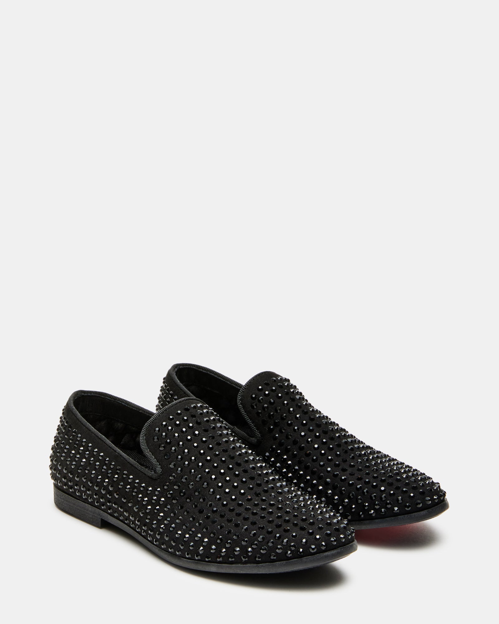 Boys wearing caviar black loafers at a formal event.