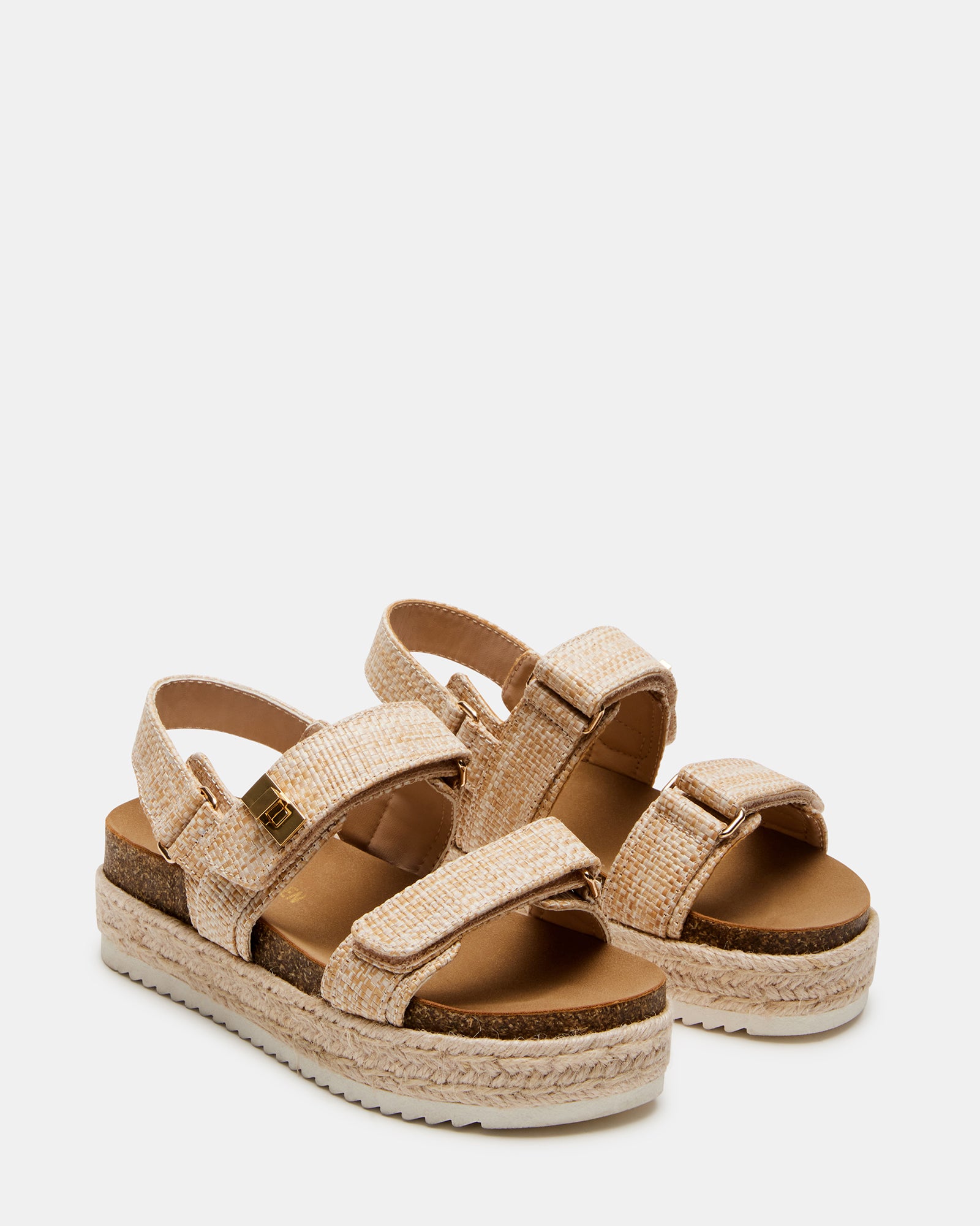 Top-down view of kids flatform sandal with velcro straps and elastic slingback, placed on a picnic blanket