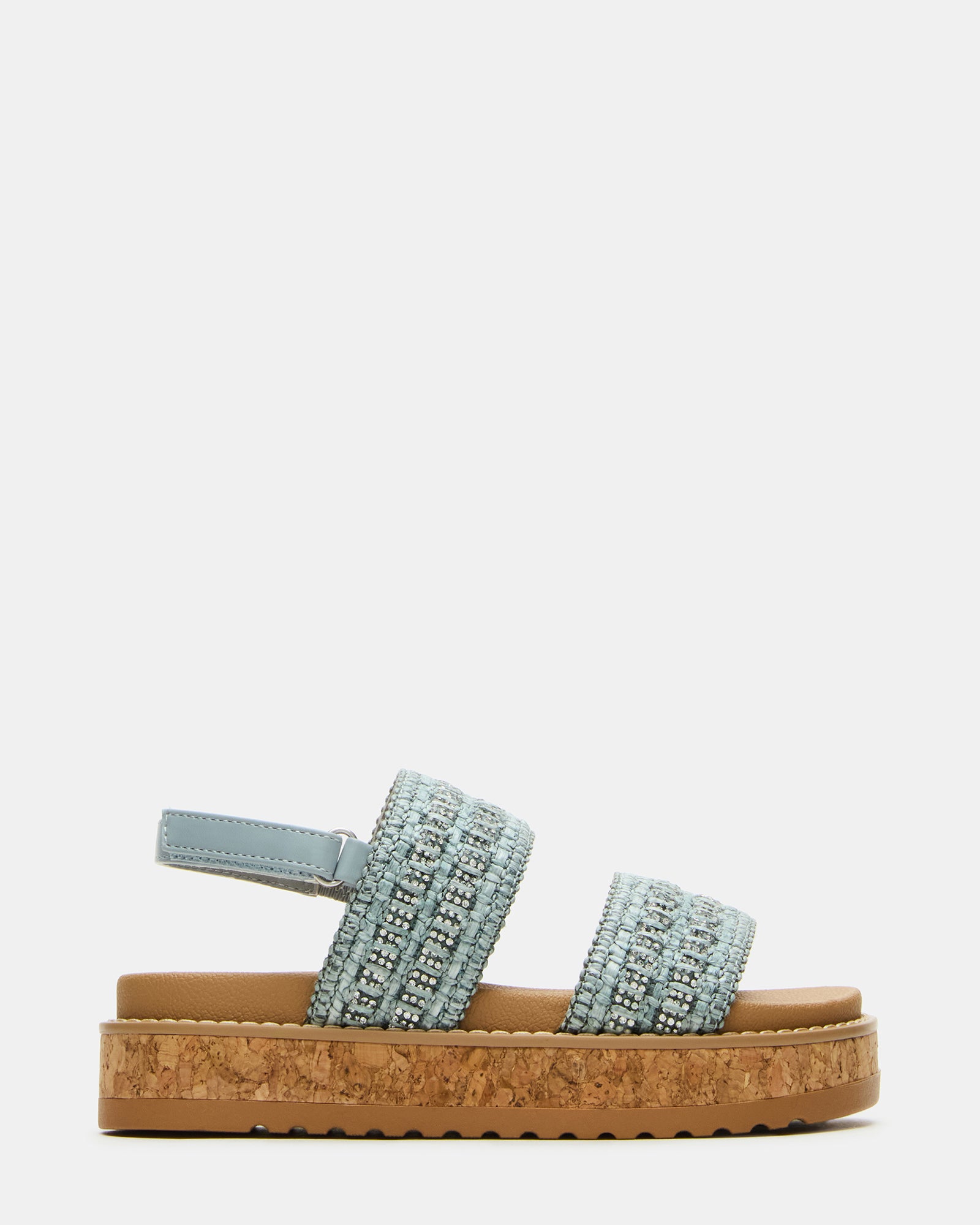Close-up of woven straps on kids' fashion sandals against a NYC backdrop