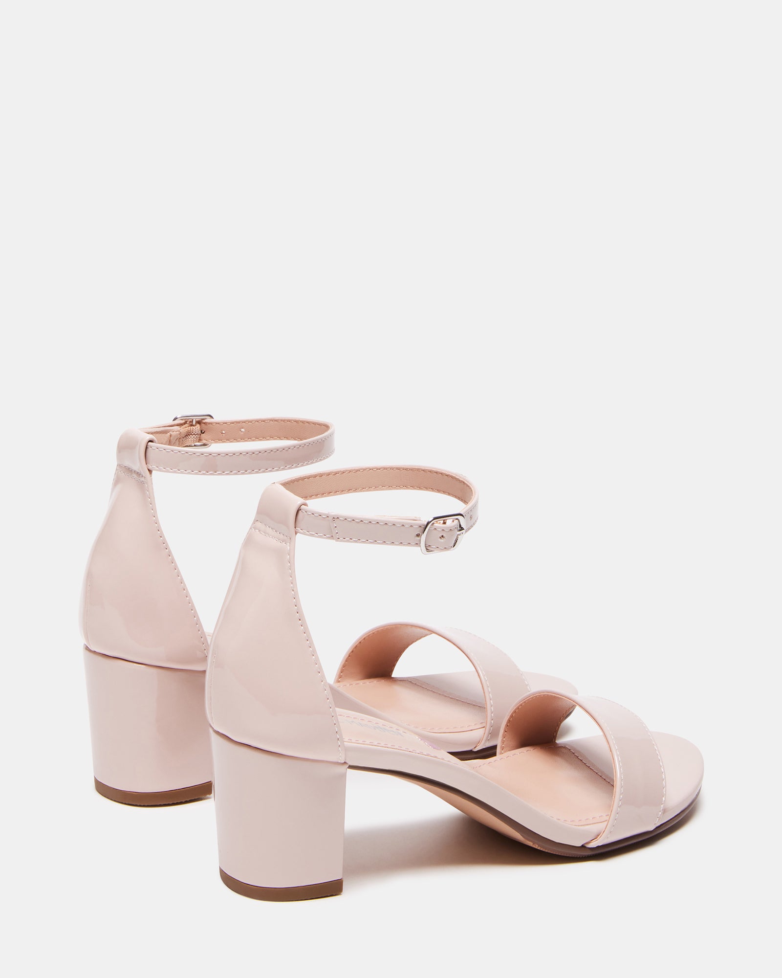 Close-up of synthetic sole and vegan lining on nude block heel sandals