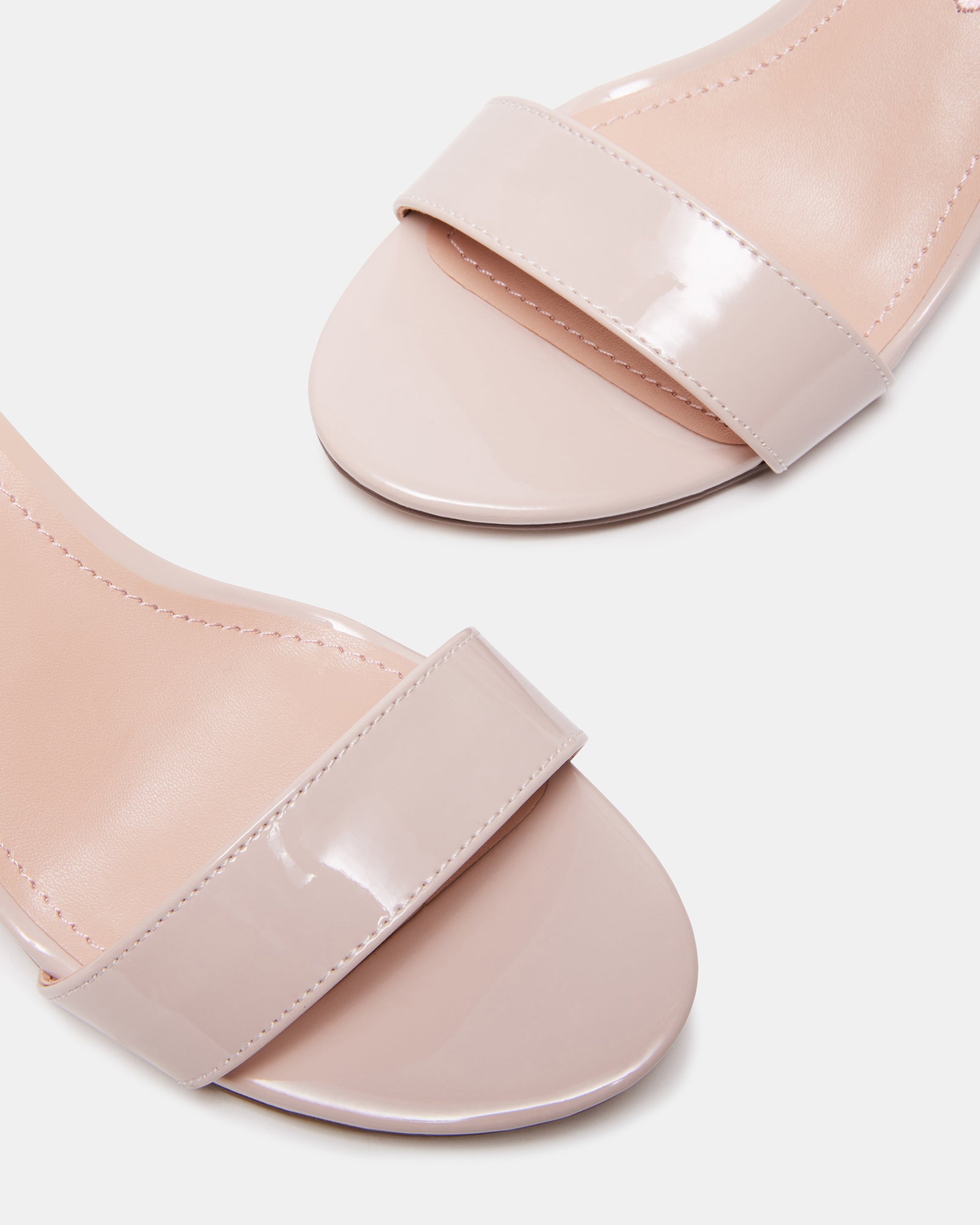 Side view of blush kids sandals with block heel and buckle strap