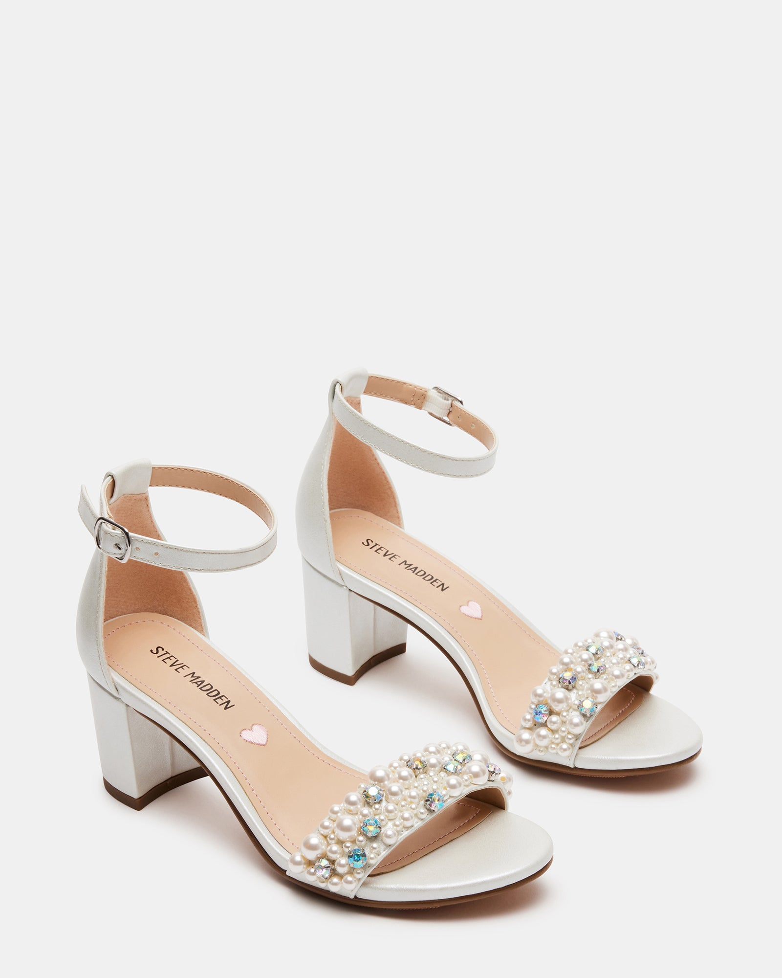 Black block heel sandals styled with pastel dress for afternoon tea
