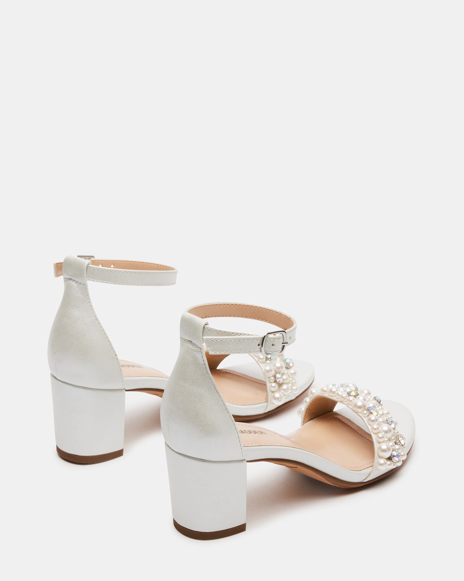 Black block heel sandals styled with pastel dress for afternoon tea