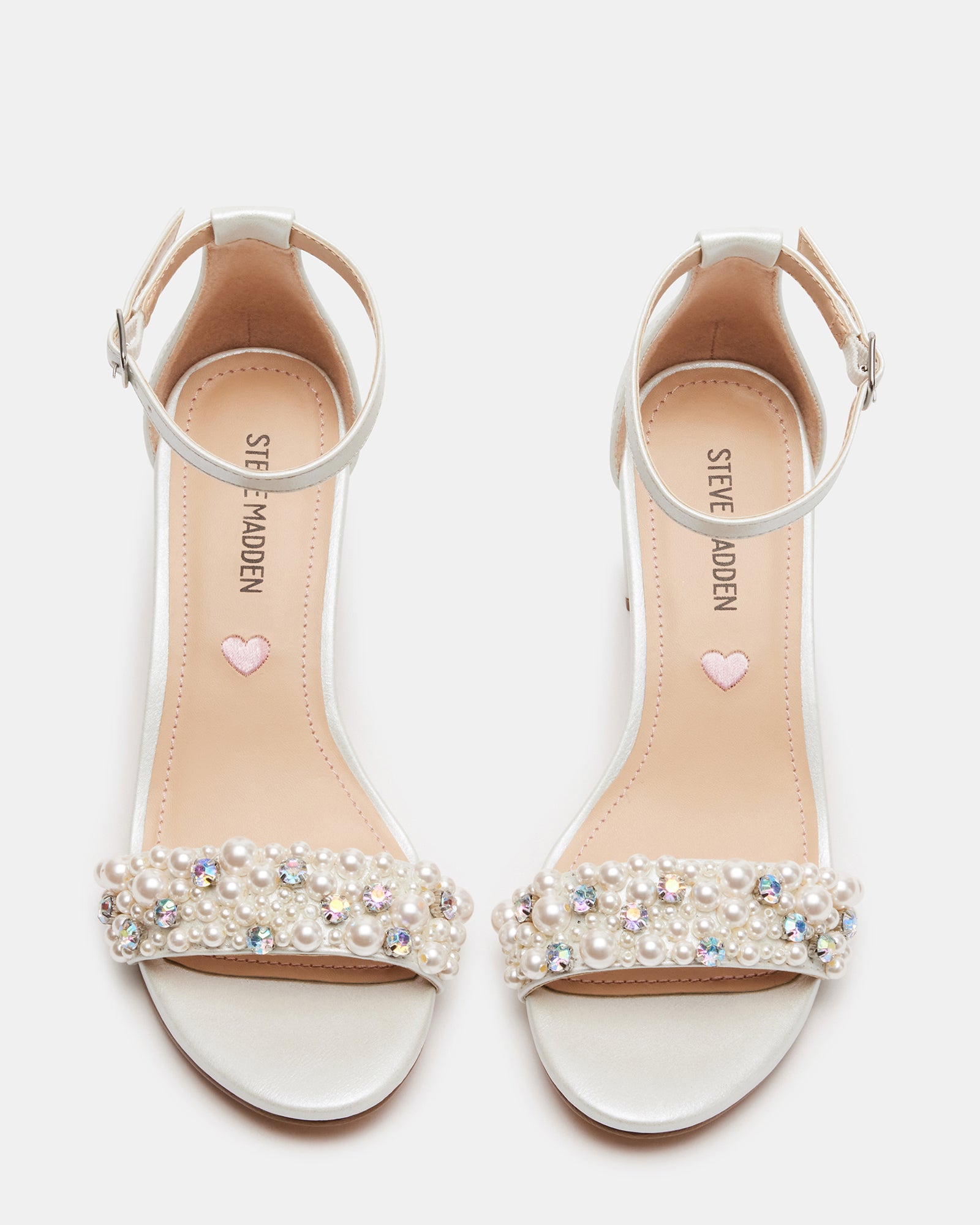 Front view of nude block heel sandals with pearl straps for girls
