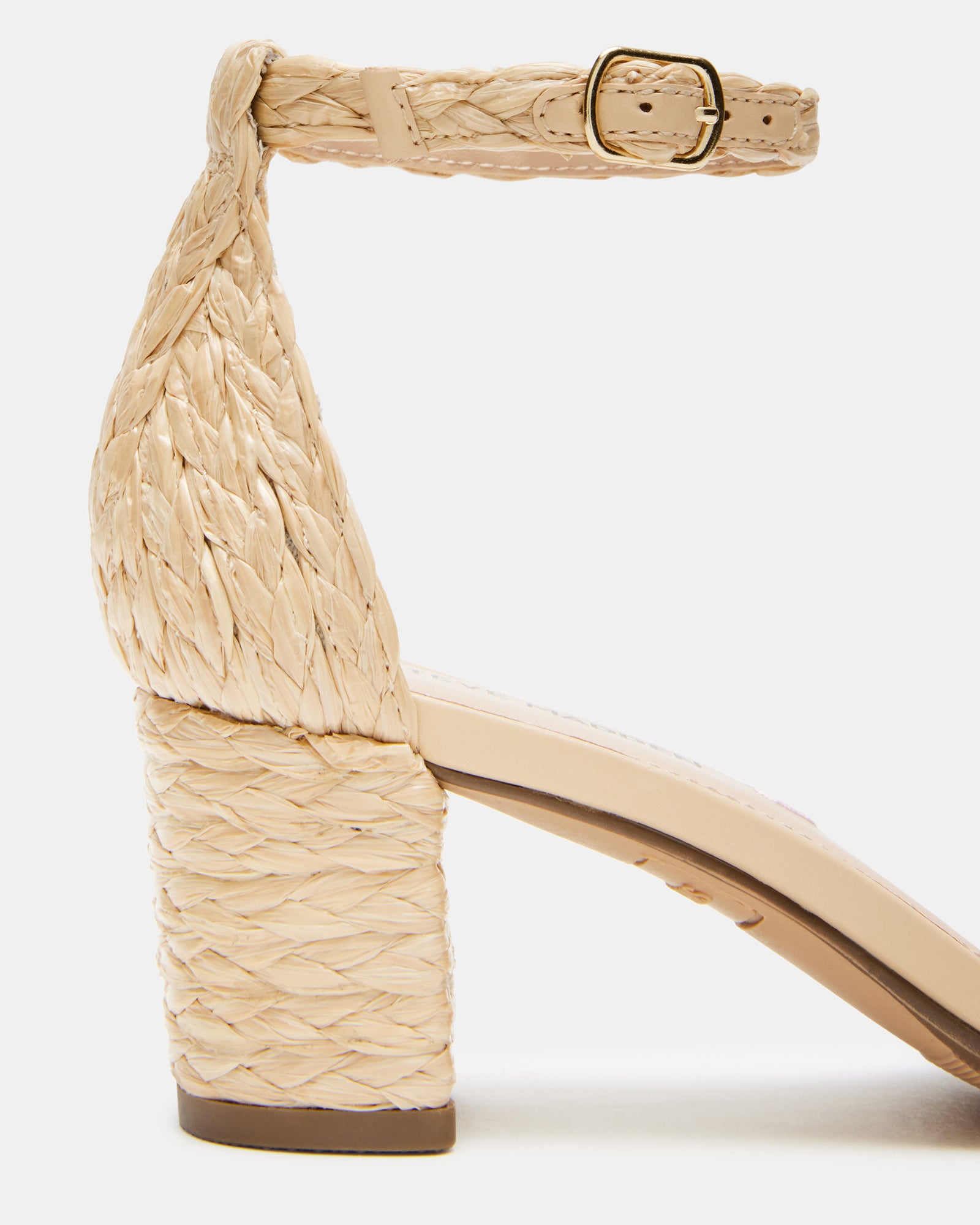 Close-up of raffia texture and vegan leather lining on kids sandals