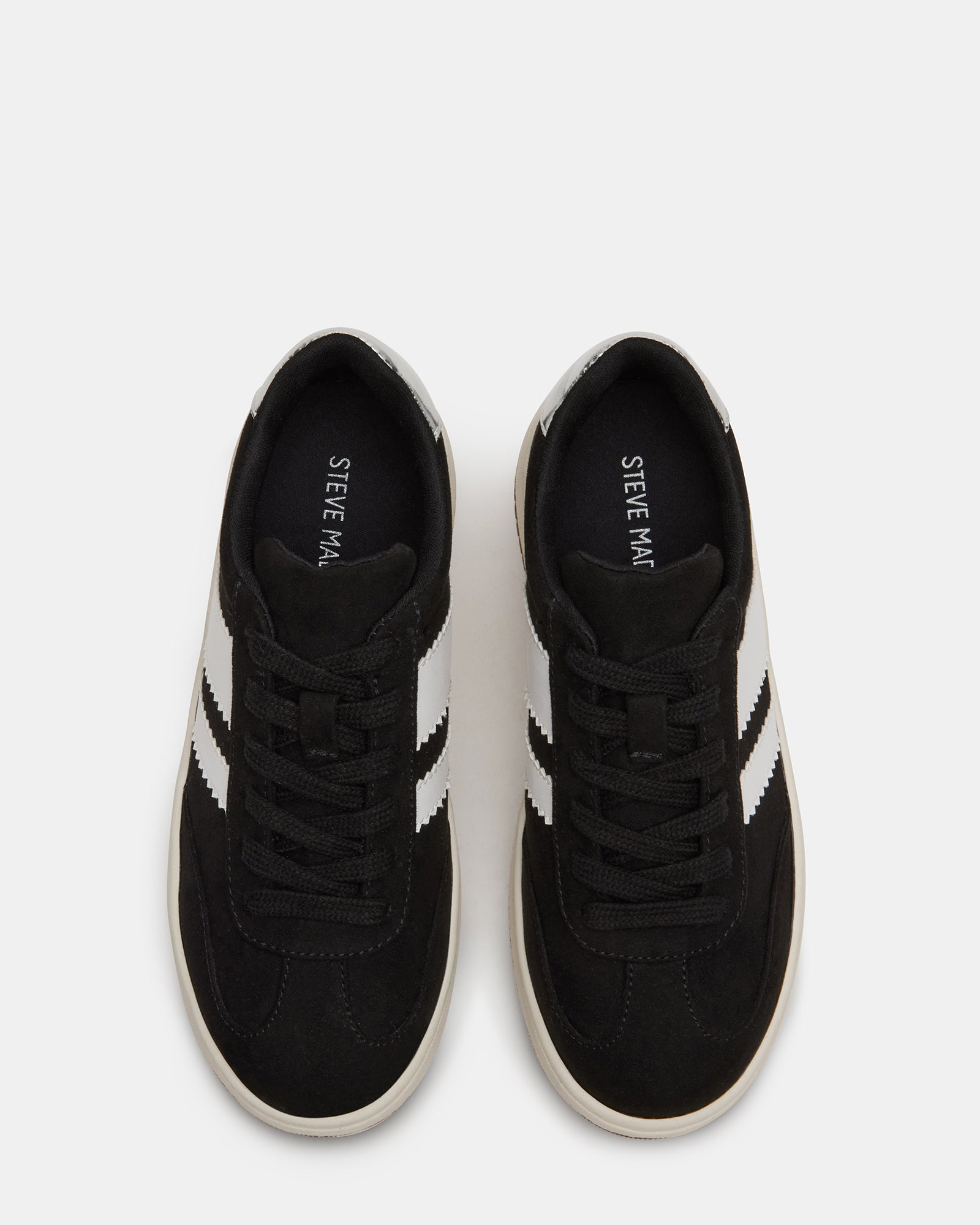 Kids FIELD Black vegan sneakers side view on a playground