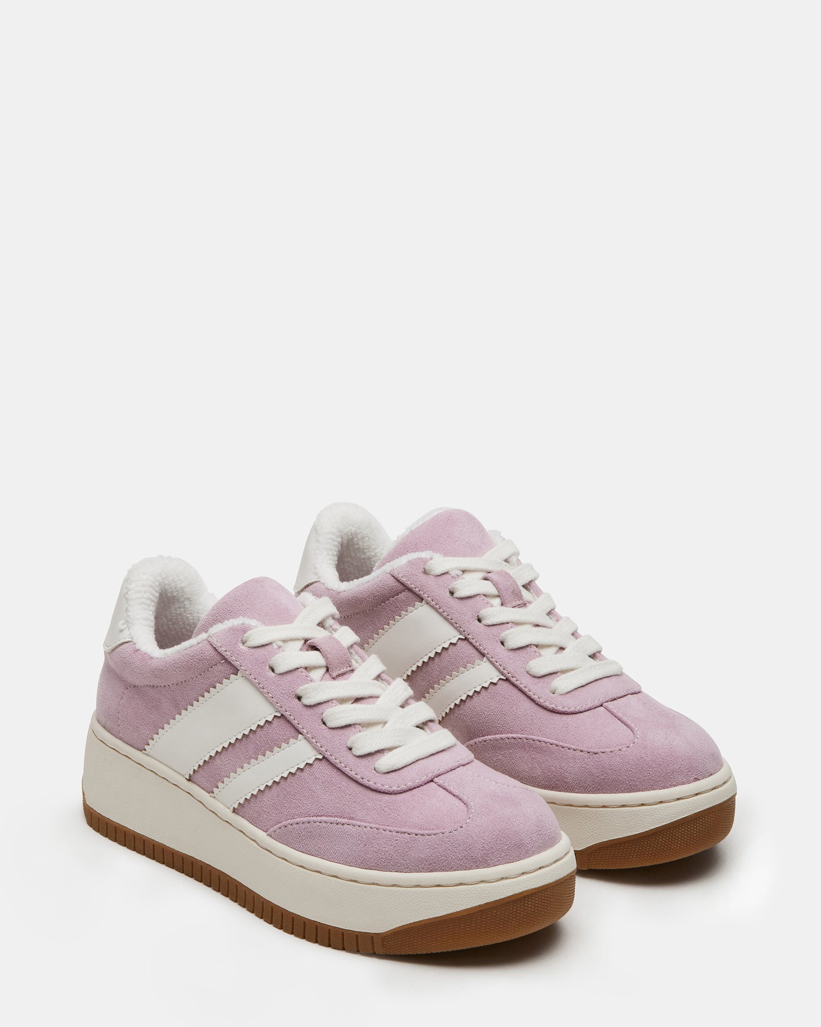 Kids wearing Field Pink sneakers during outdoor activities.