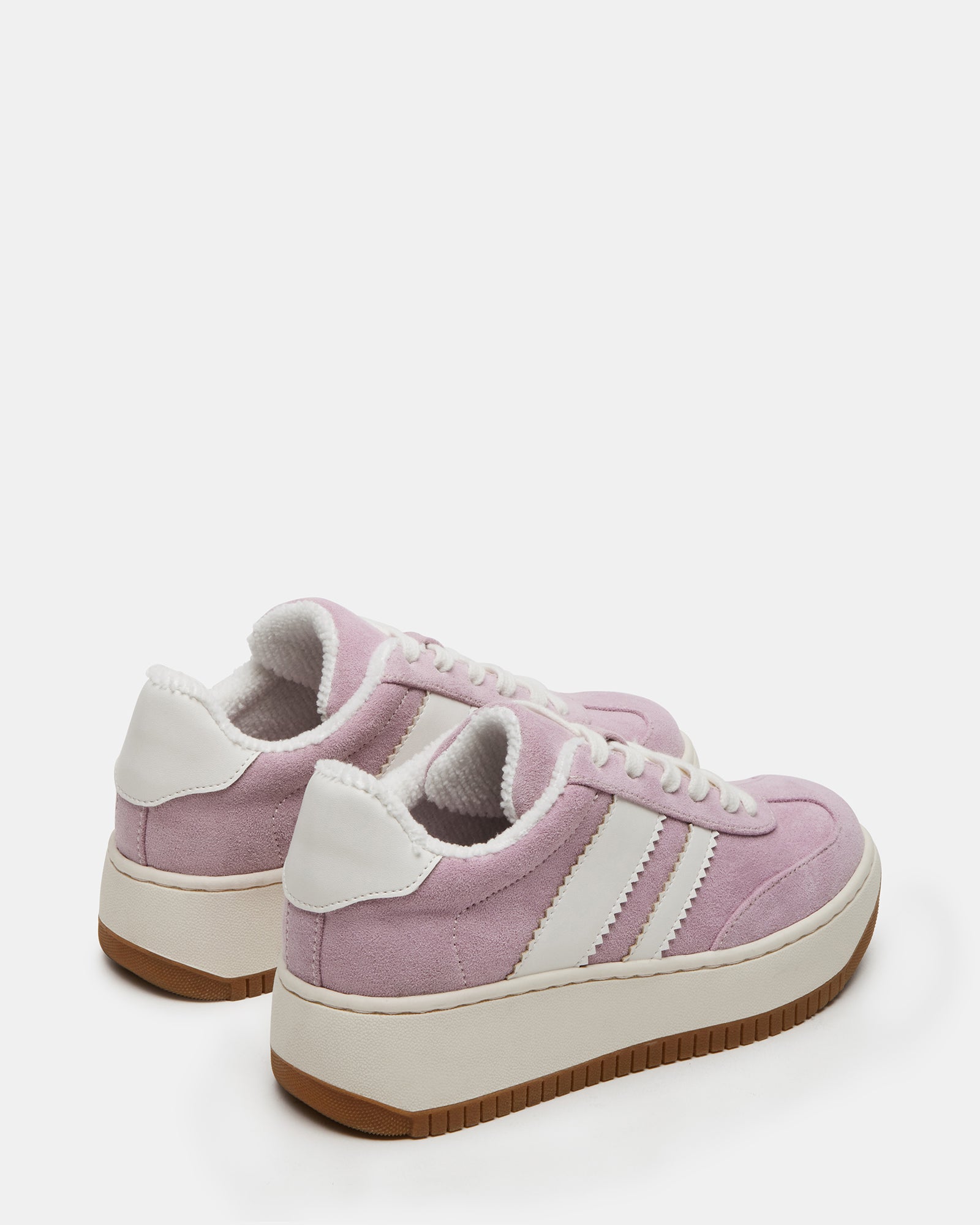Kids wearing Field Pink sneakers during outdoor activities.