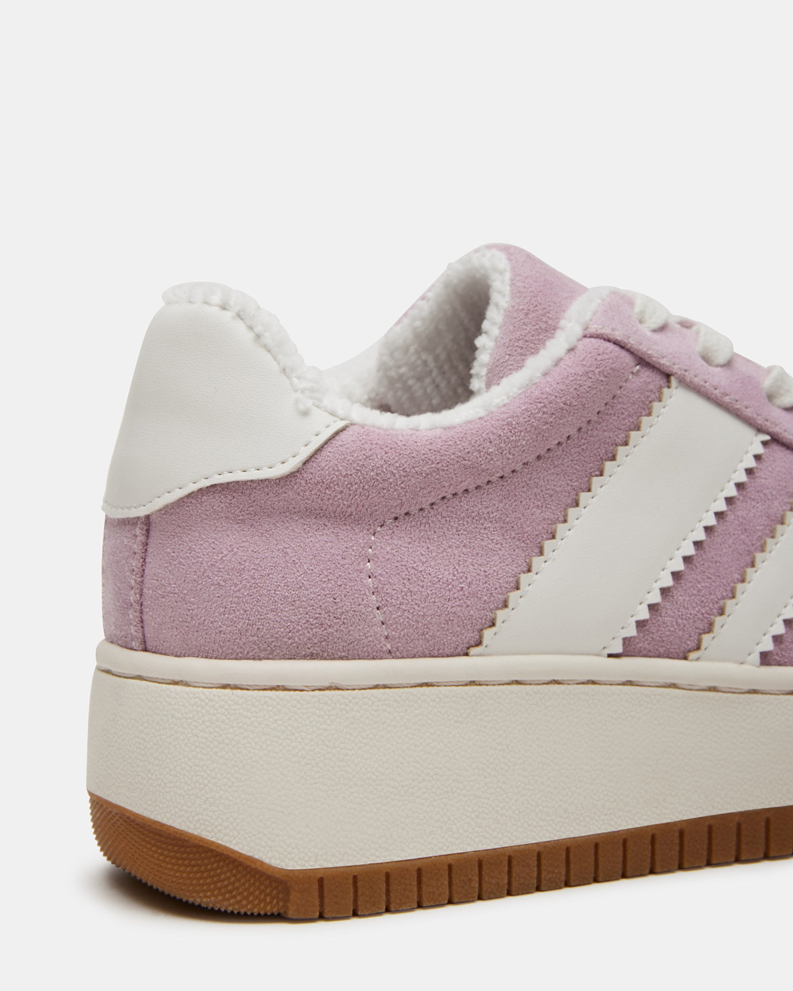 Close-up of the lace-up style and vegan leather of the sneakers.