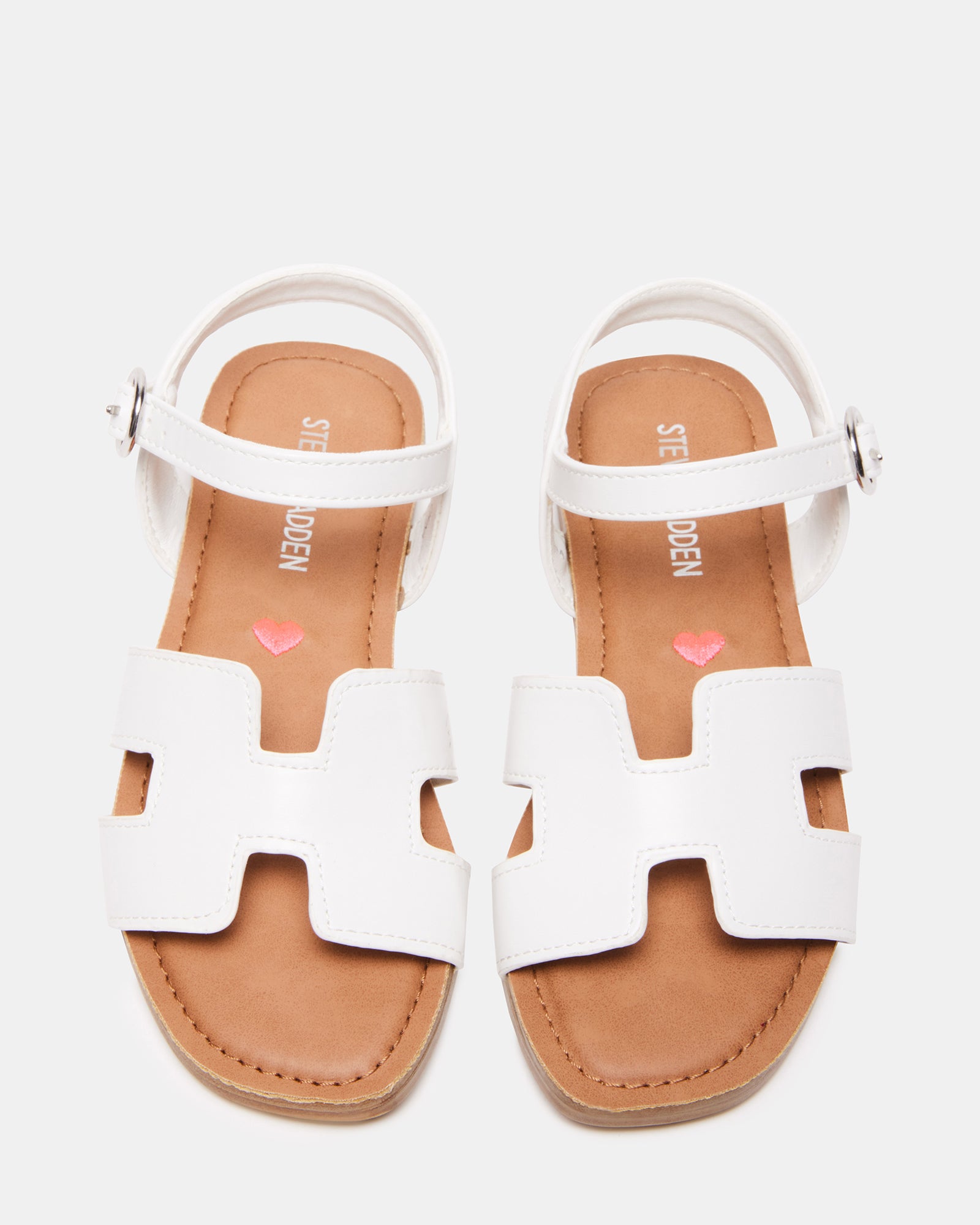 Side view of white childrens sandals with cutout design