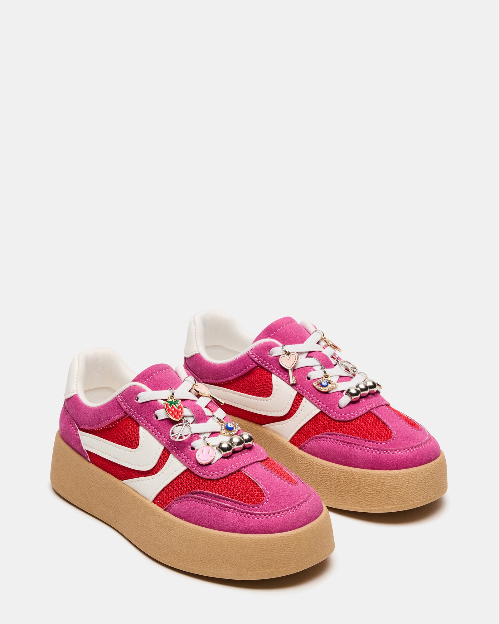 Close-up of lace-up hot pink sneakers highlighting textile finish and heel height