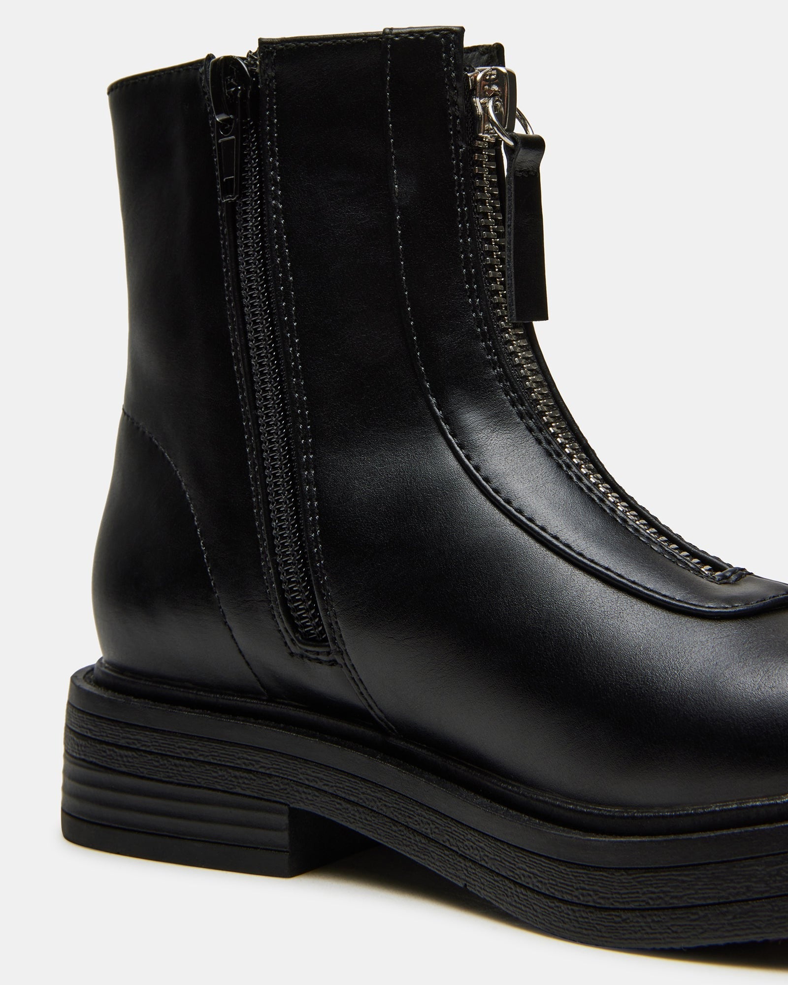 Close-up of the zipper detail on vegan leather kids ankle boots.