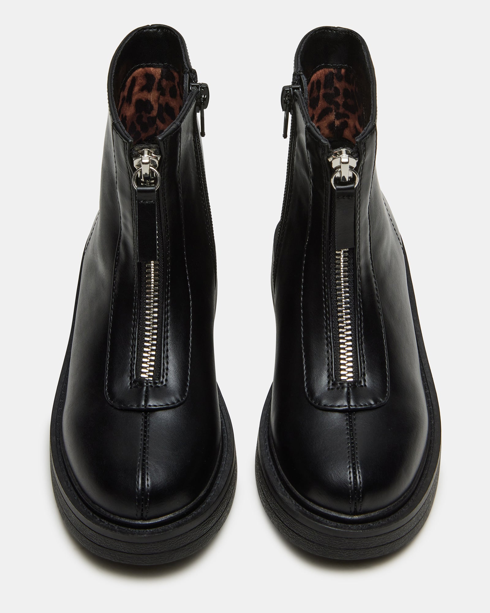 Side view of black vegan leather kids ankle boots with zipper.