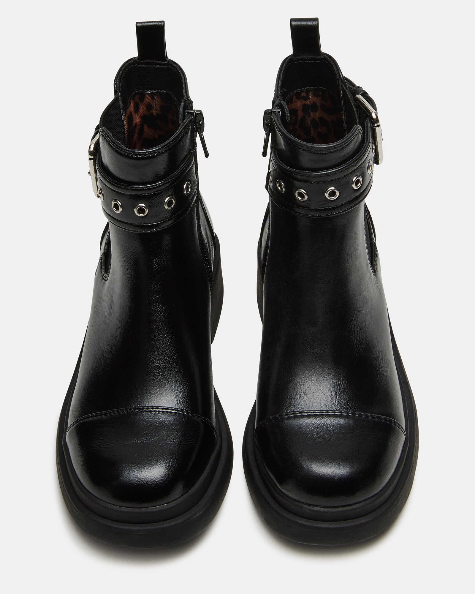 Side view of black moto kids boots with buckle detail and synthetic sole