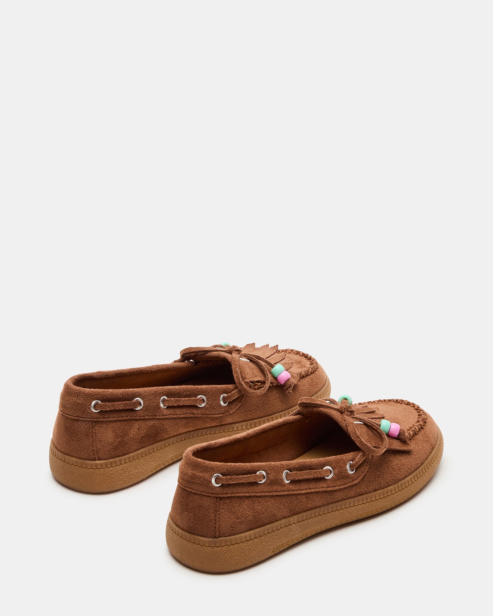 Close-up of the gum sole on childrens loafers, designed for daily traction