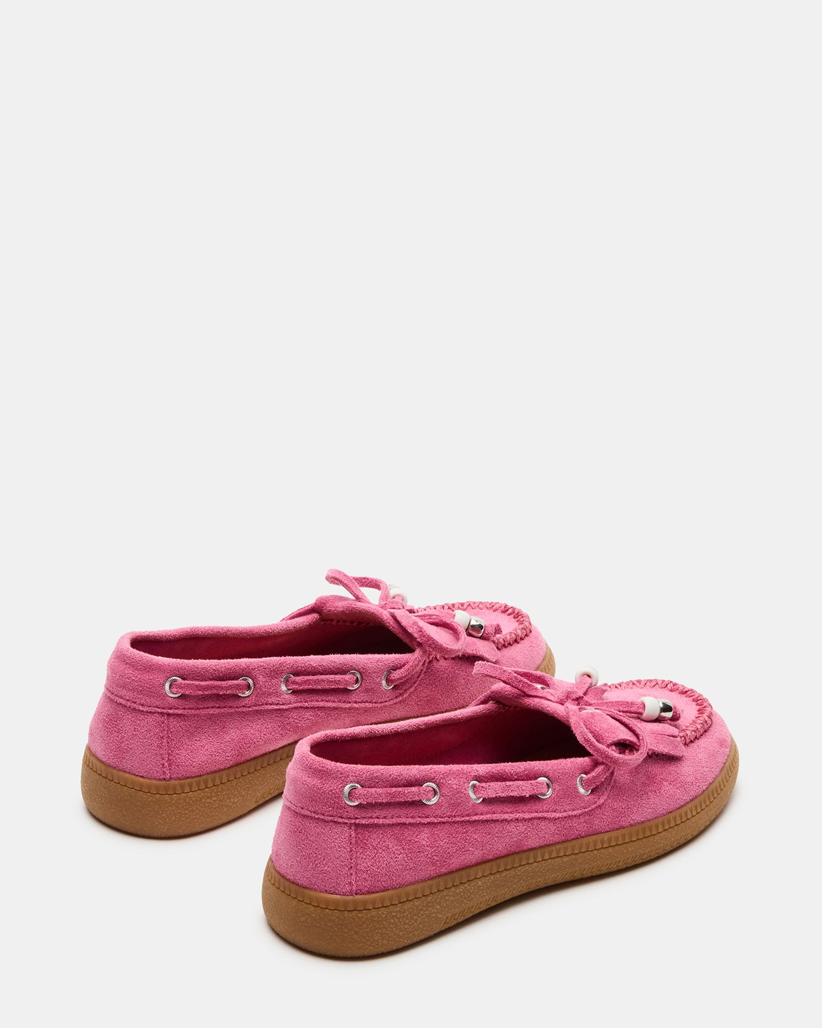 Close-up of bead and fringe details on childrens loafers