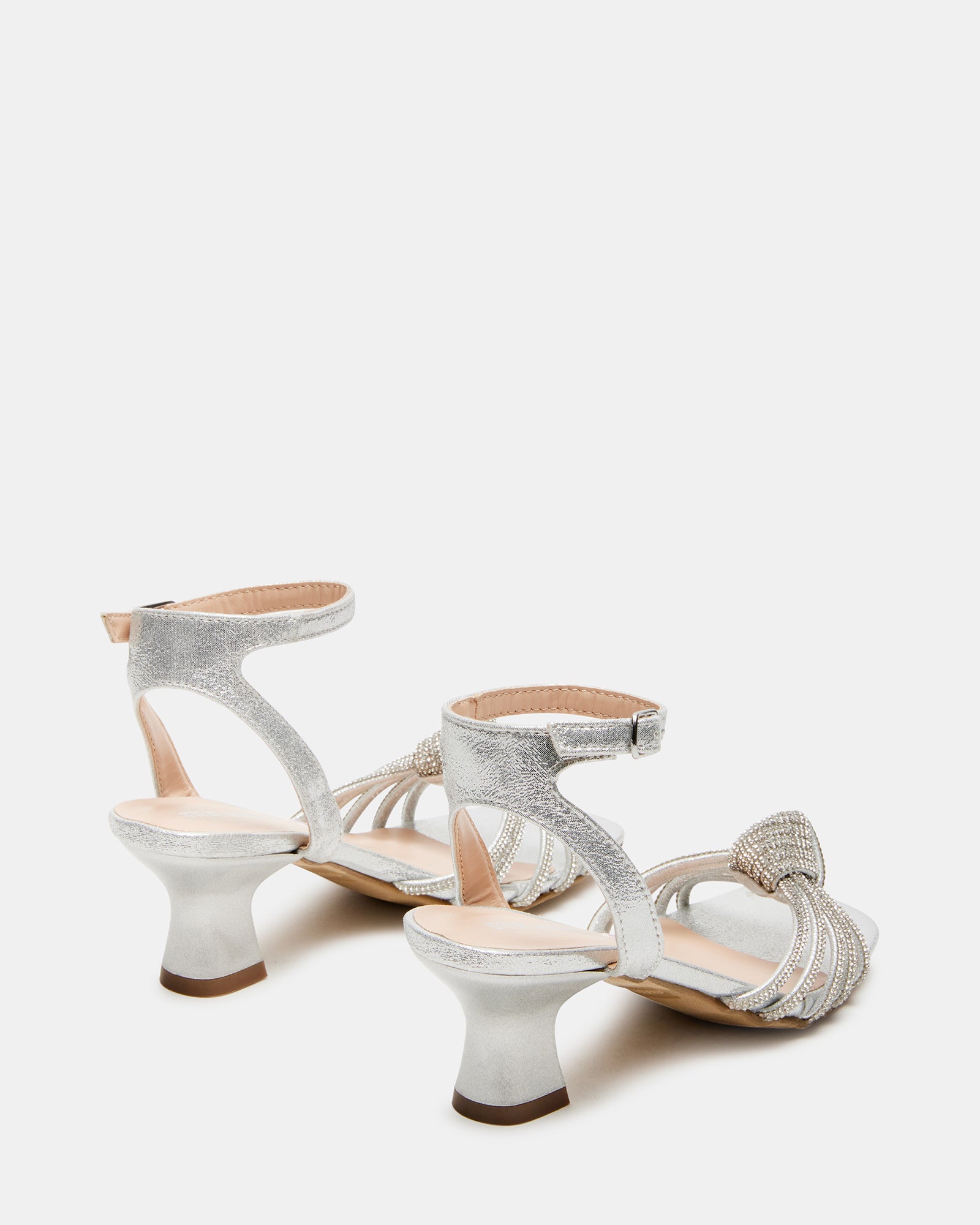 Side view of stylish girls strappy dress shoes with mini heel