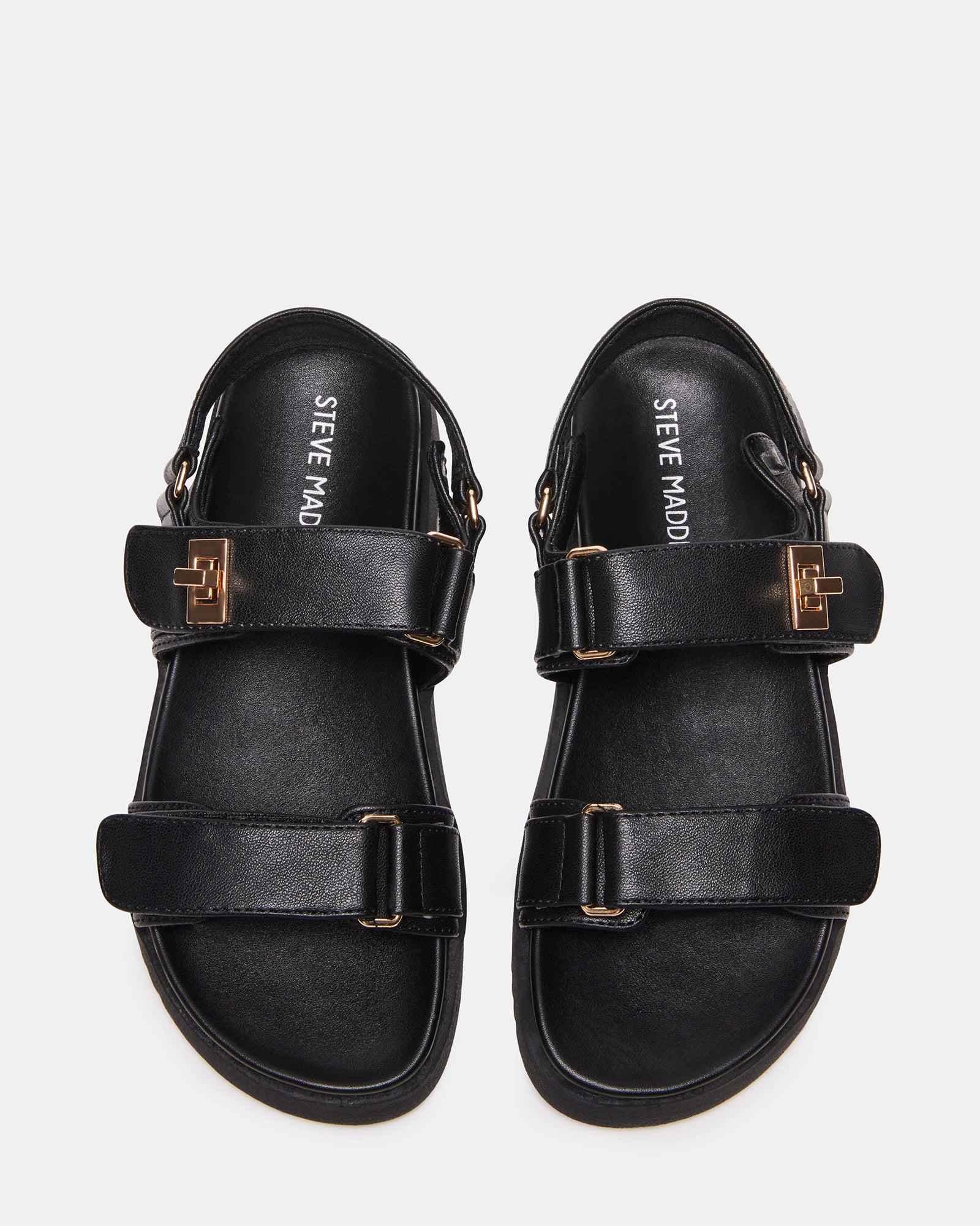 Side view of Mona Kids Fashion Sandals in Black on grass.