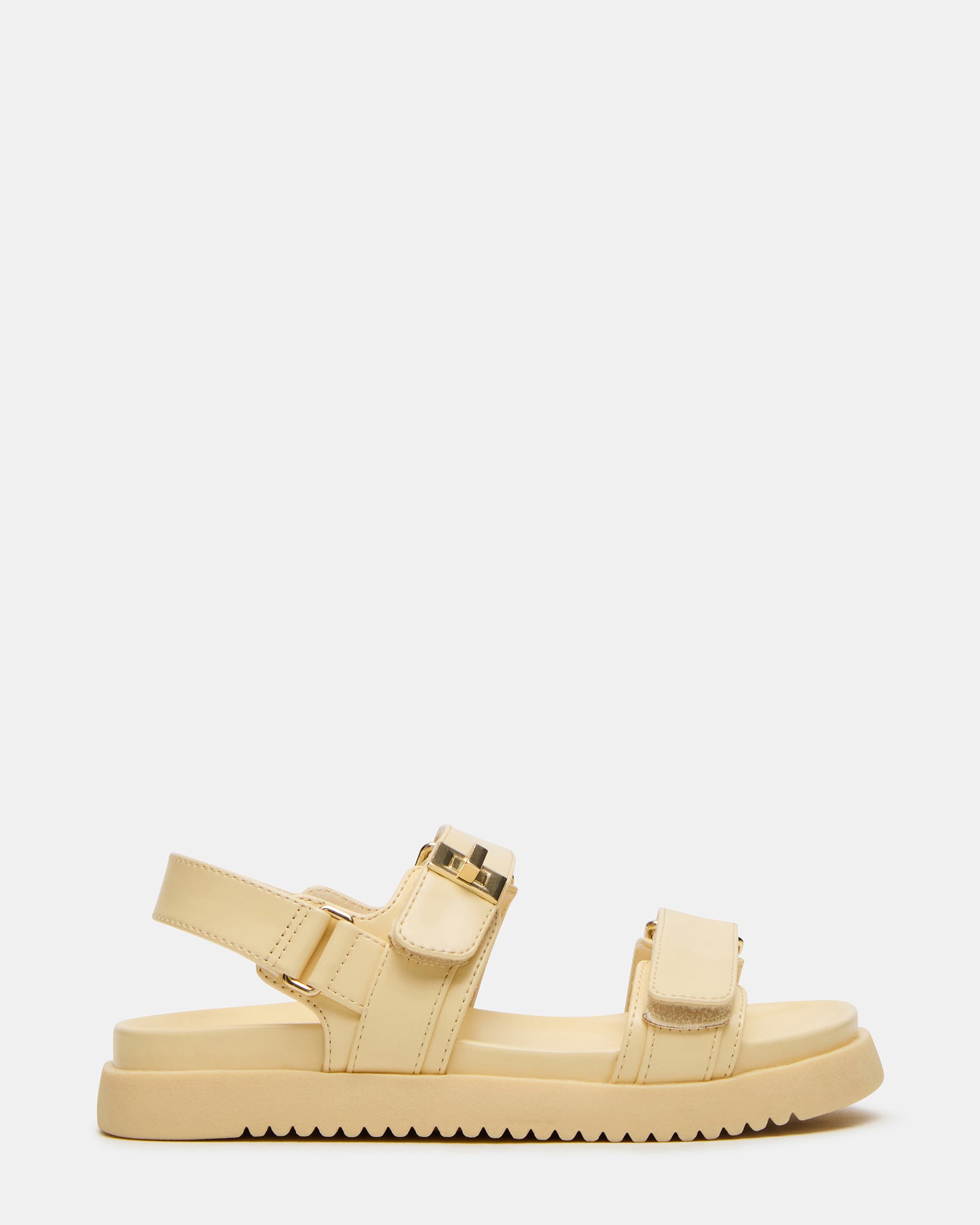 Close-up of velcro ankle strap on girls sandal showcasing secure fit and synthetic finish.