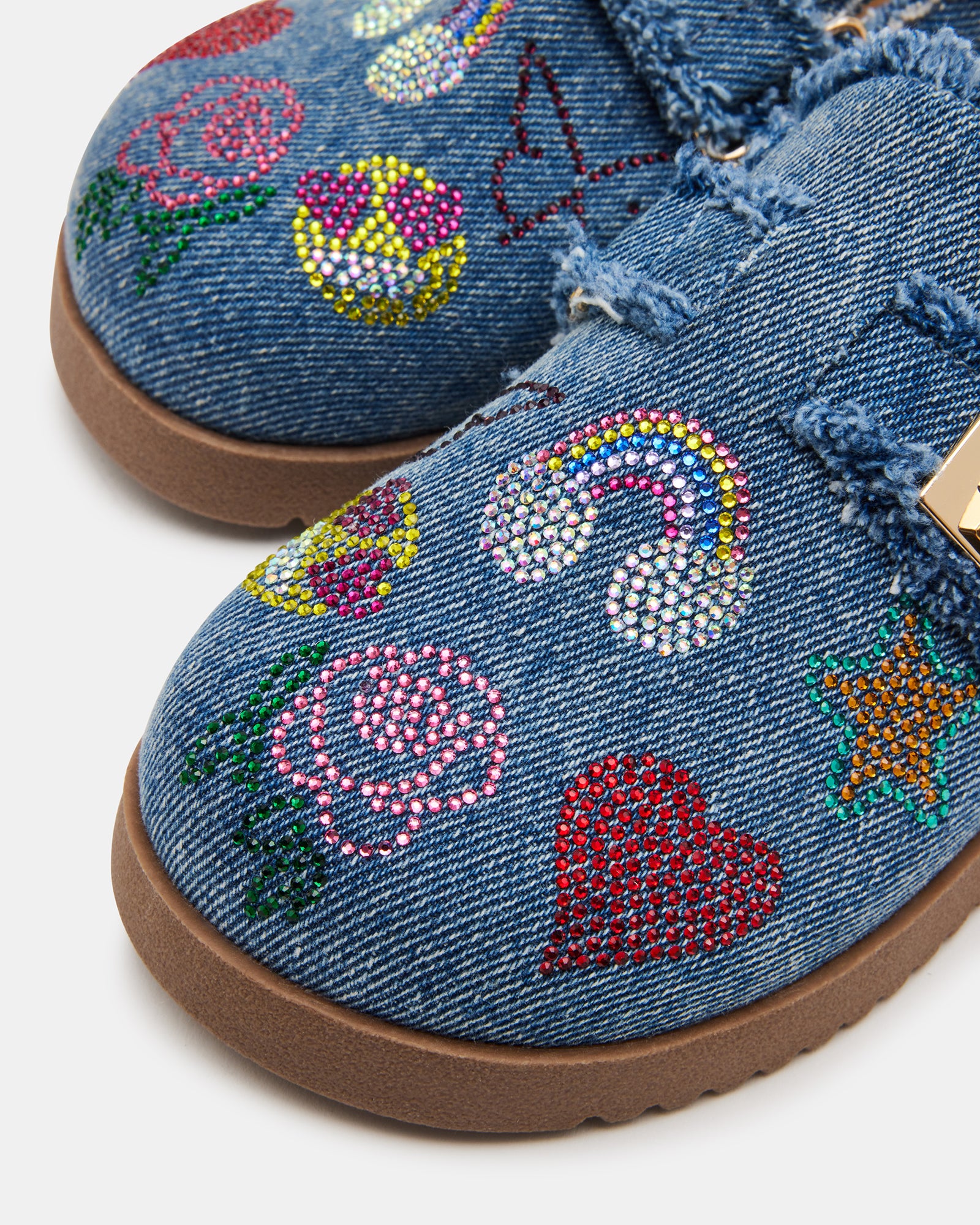 Childrens clogs styled on a playground in sunny Southern California