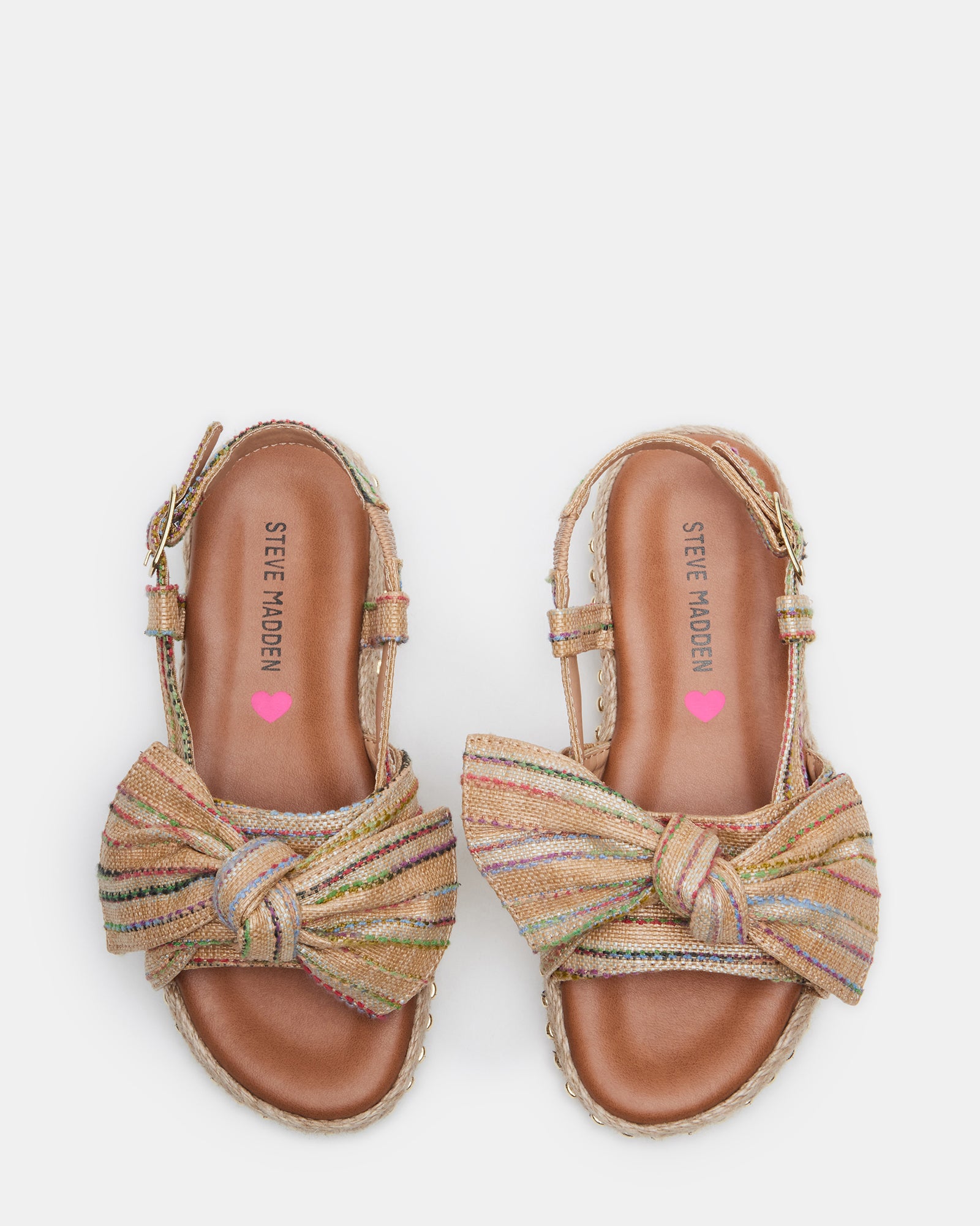 Charming kids platform espadrille sandals with bow detail on a sunny day