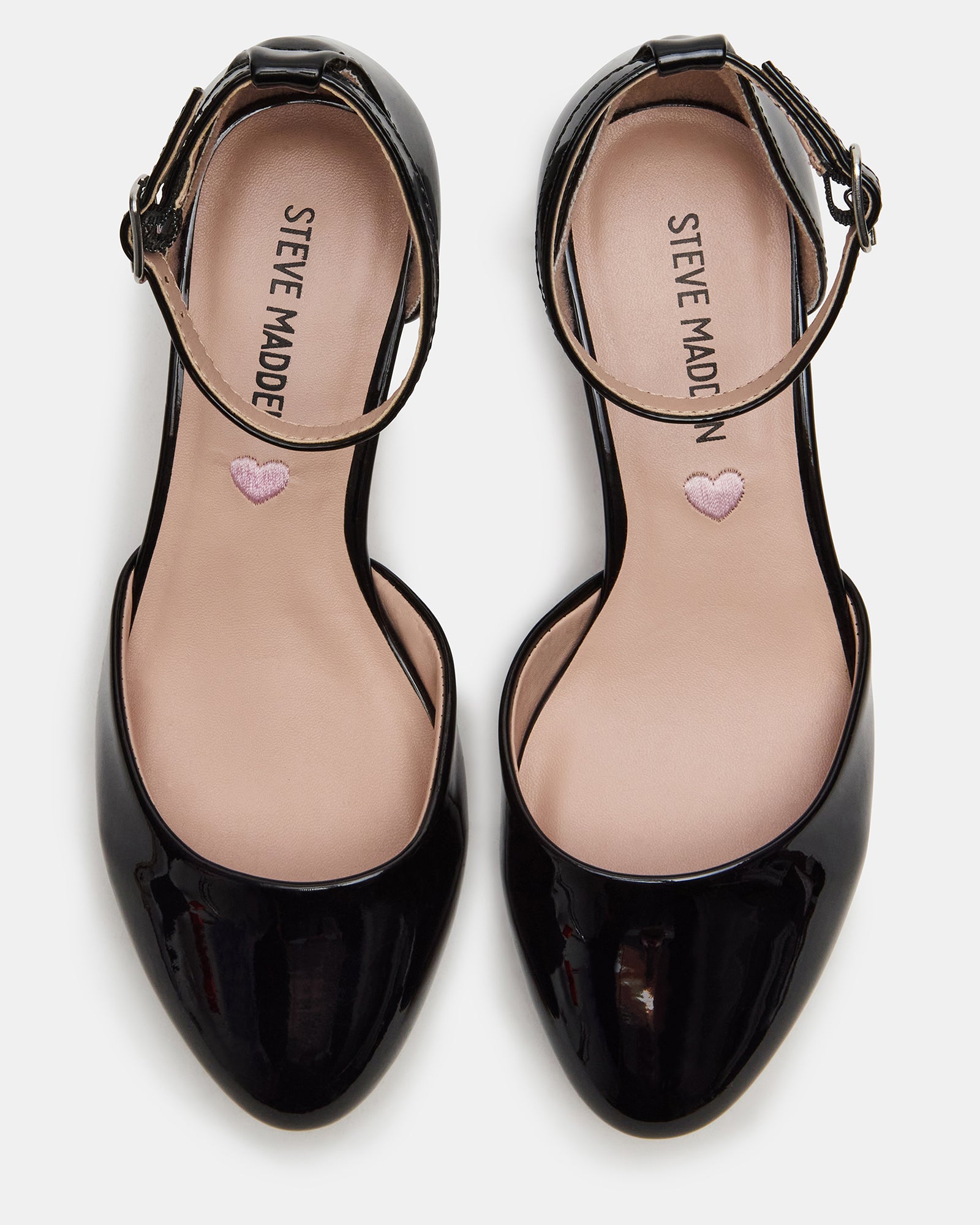 Front view of kids black patent Mary Janes with block heels, styled for birthday parties.