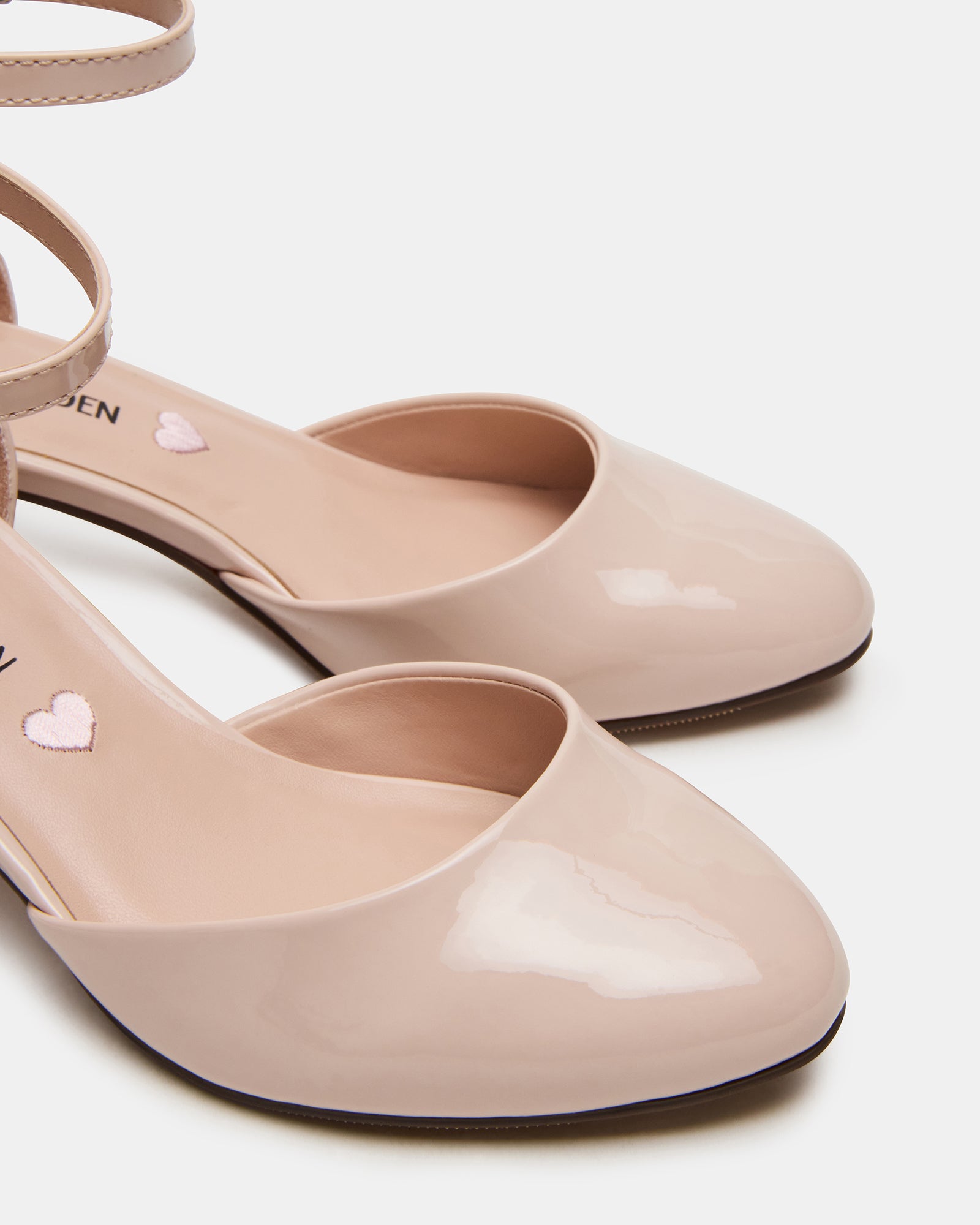 Pretty Blush shoes styled with a dress for special occasions.
