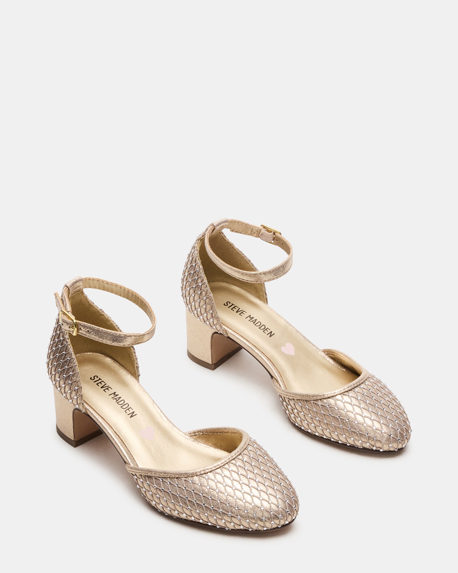 Side view of stylish kids footwear featuring a supportive heel and gold finish