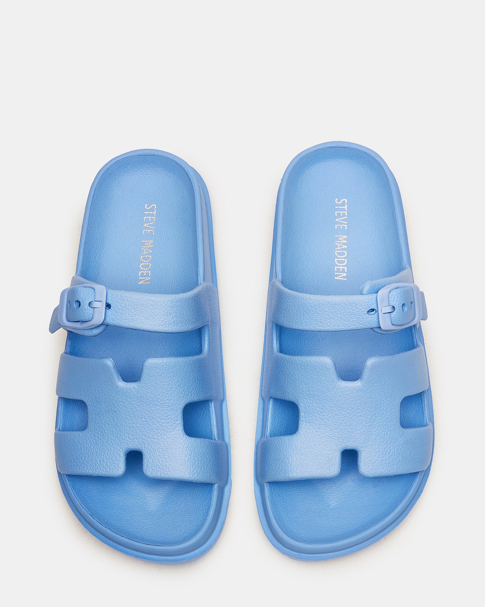 Close-up of SpiritLite kids slide sandals showing synthetic upper and flatform sole