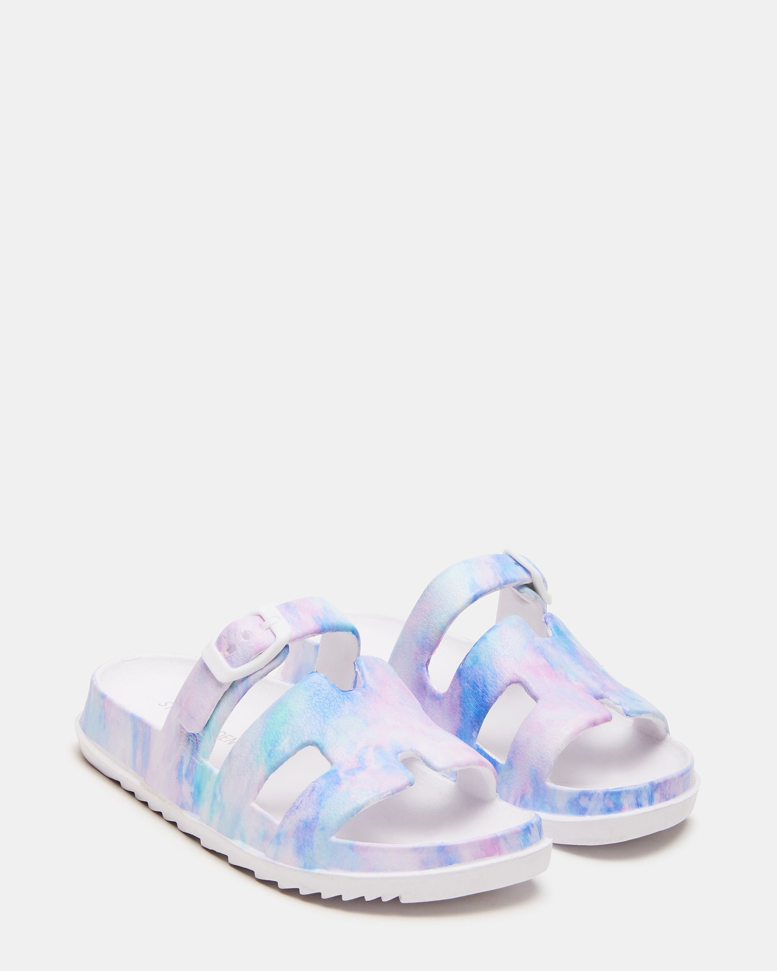 Child wearing slide sandals at the beach, showcasing comfort and fit.