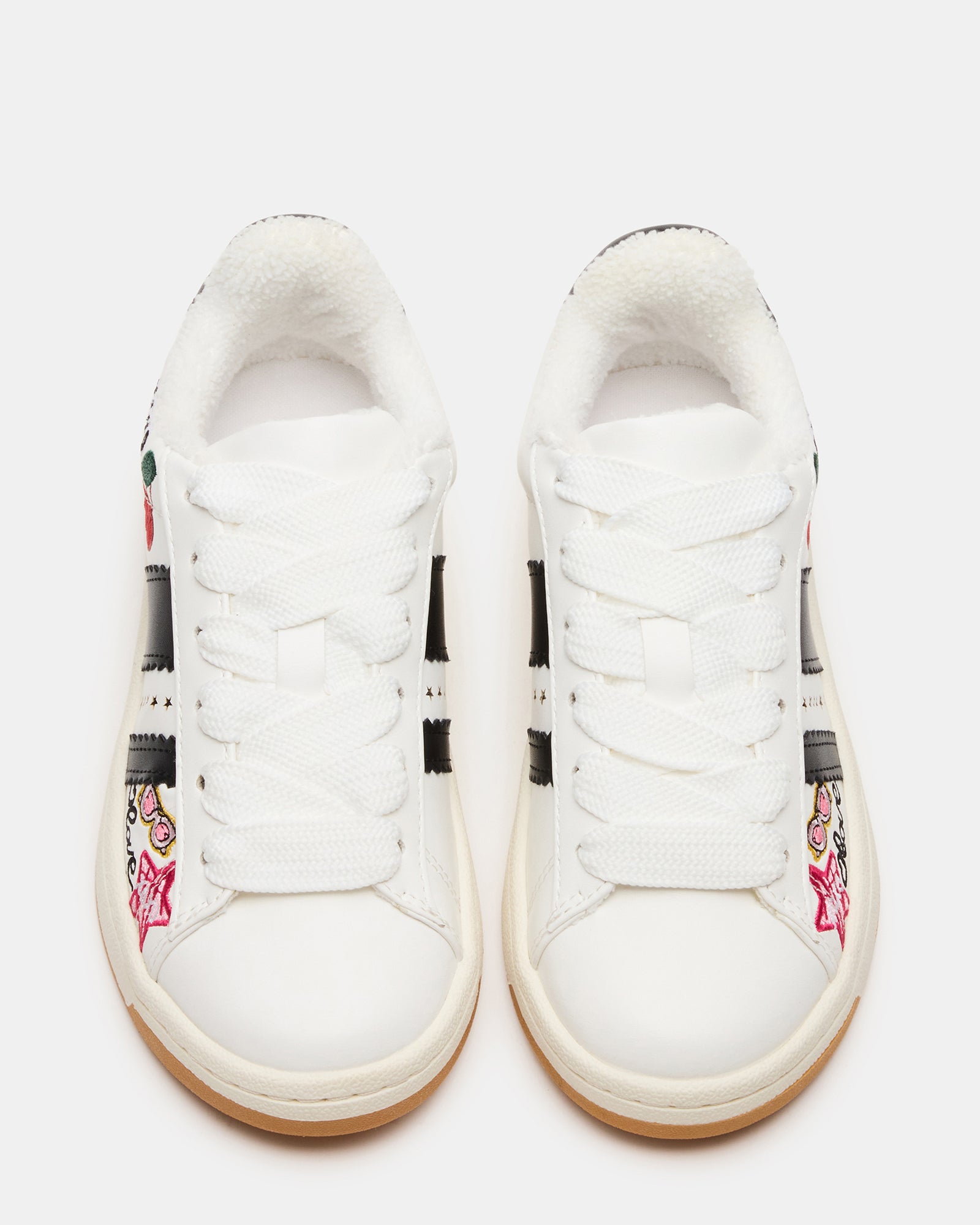 Side view of childrens shoes with white multi-color patchwork pattern