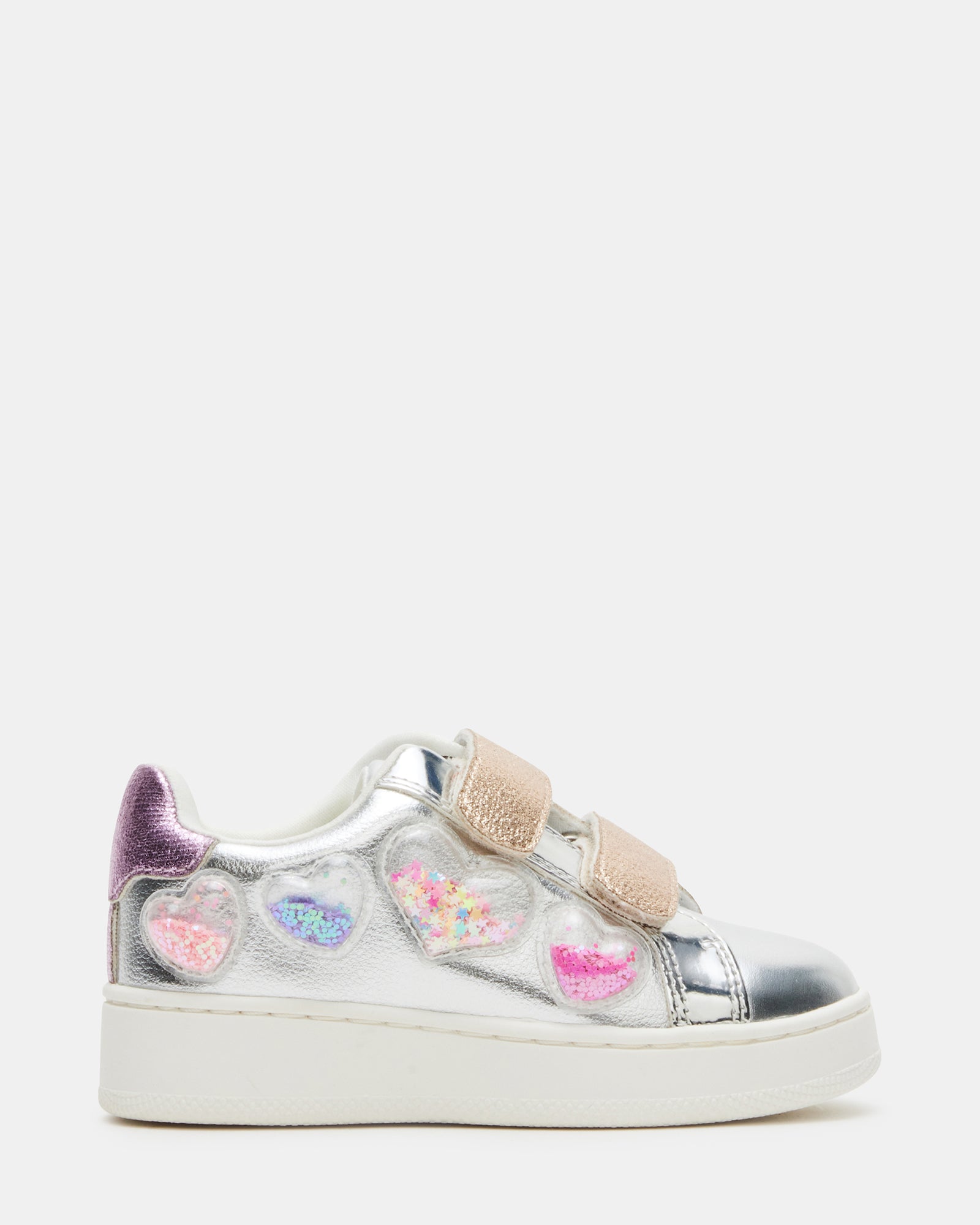 Side view of toddler sneakers showing Velcro closure and heart patterns