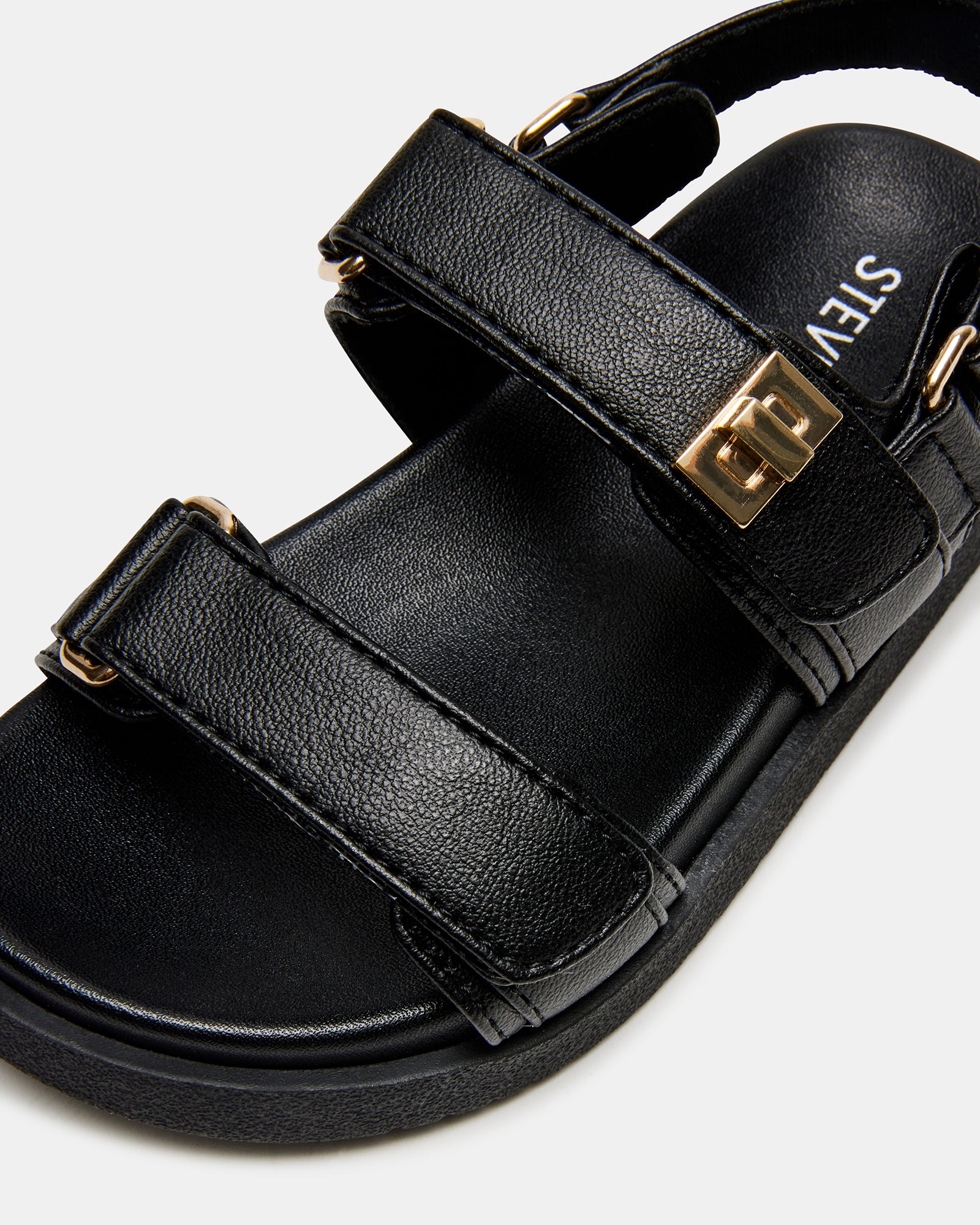 Toddler wearing Mona black sandals outdoors, perfect for warm-weather outings