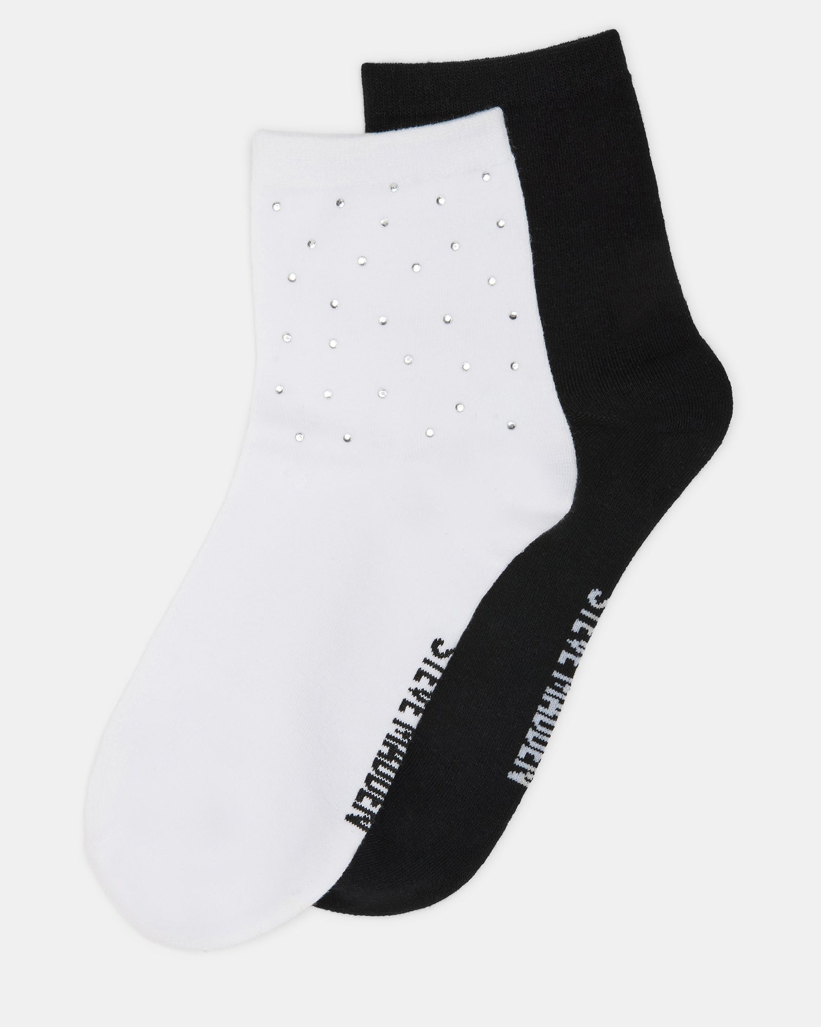 Close-up of glitter sock detailing on white quarter sock