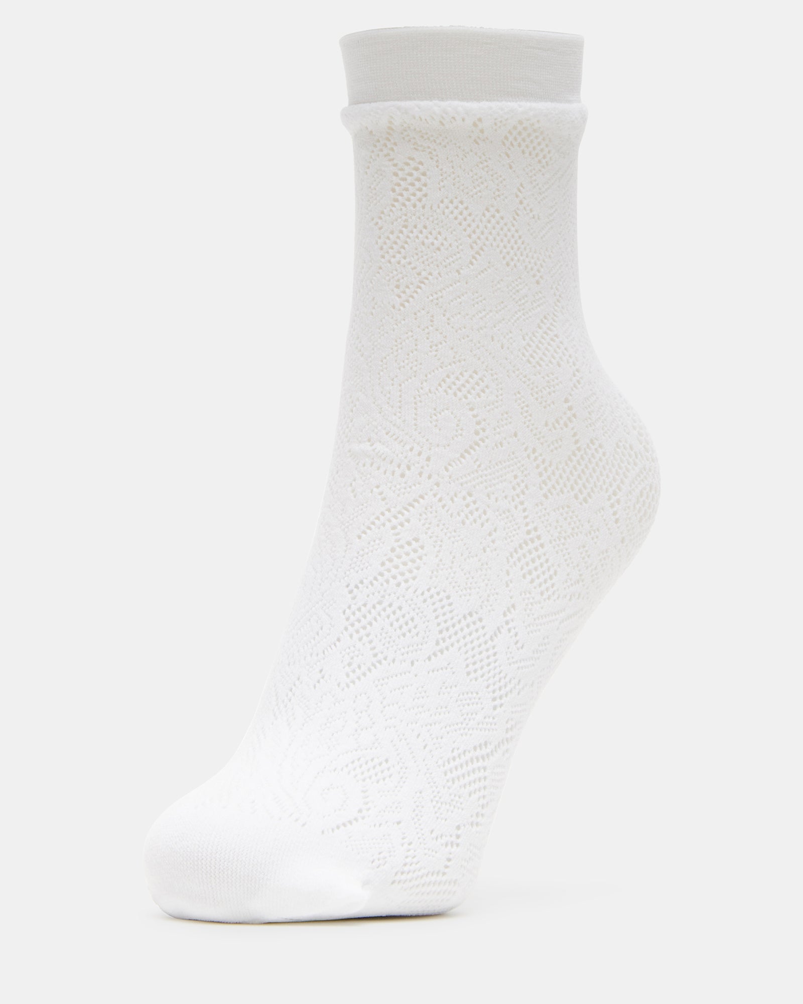 Model wearing white lace socks with a casual outfit.