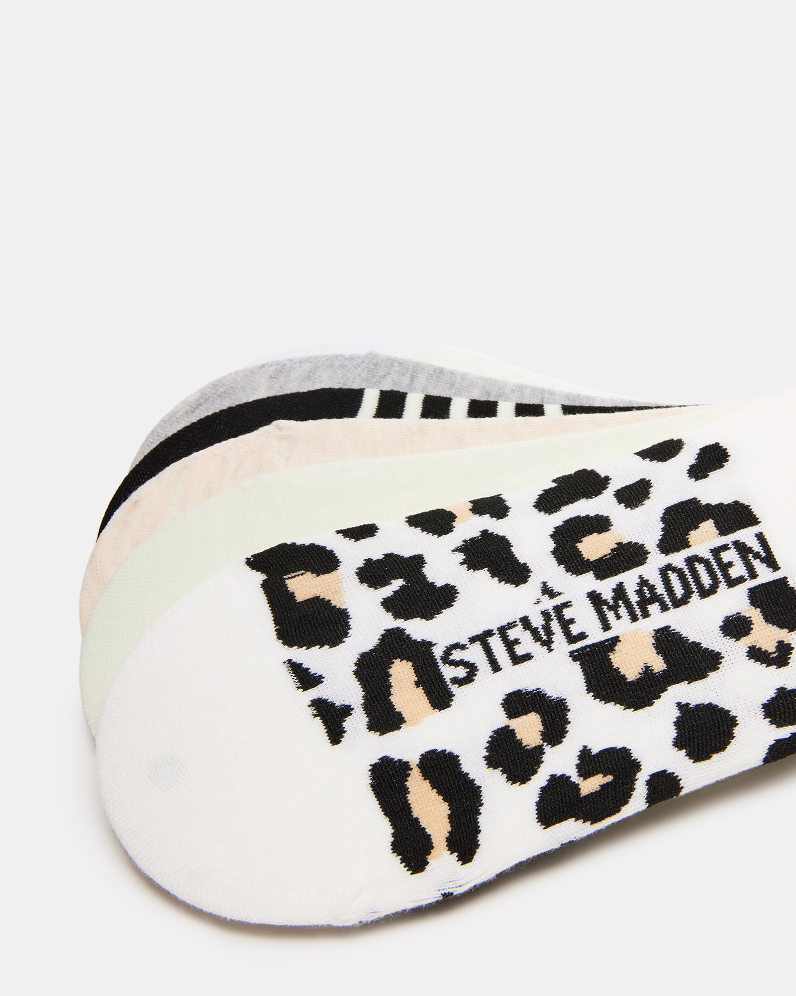 Flat lay of the SLITHR sneaker socks pack with various designs.