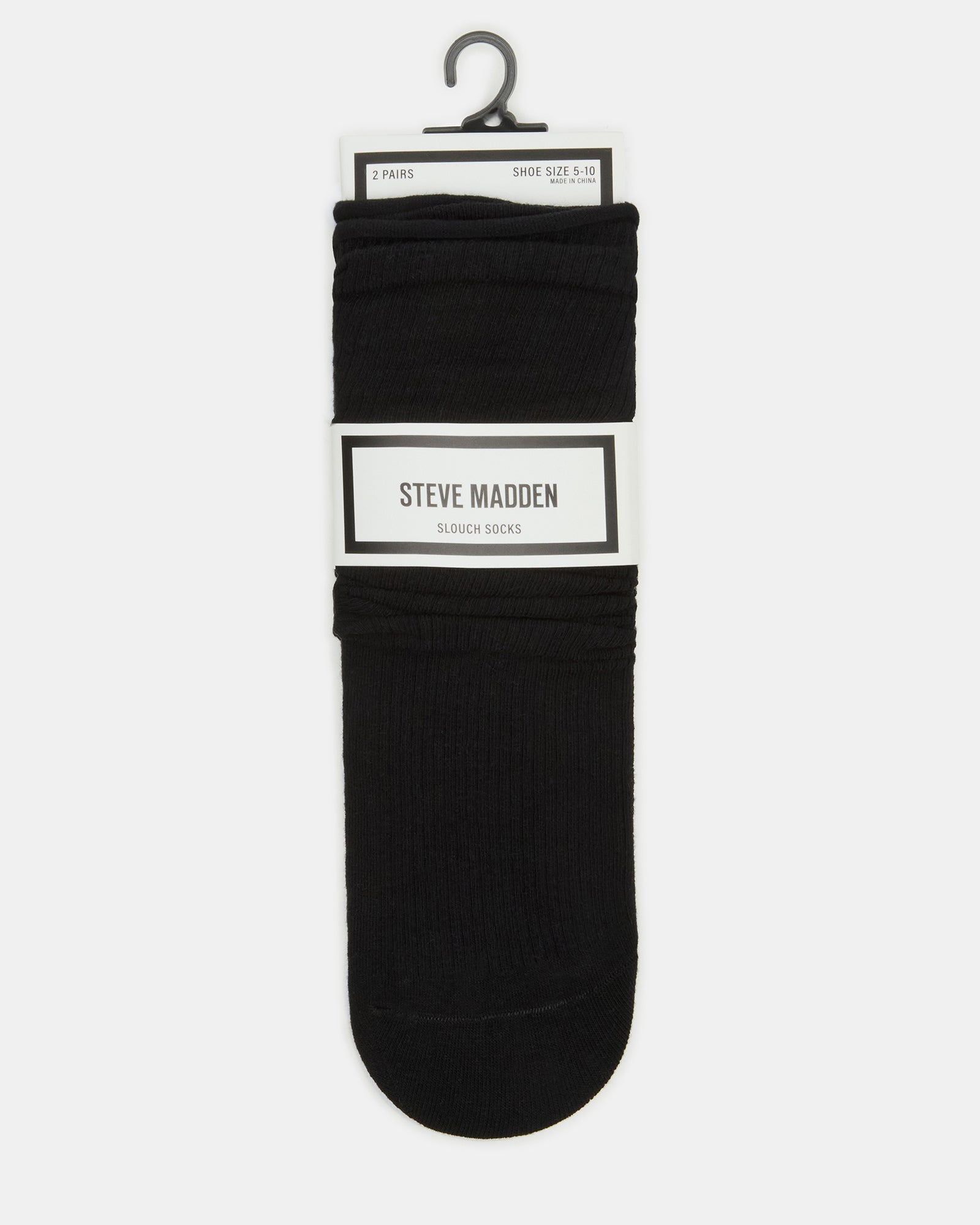 Side-by-side view of black and white striped socks on wooden surface