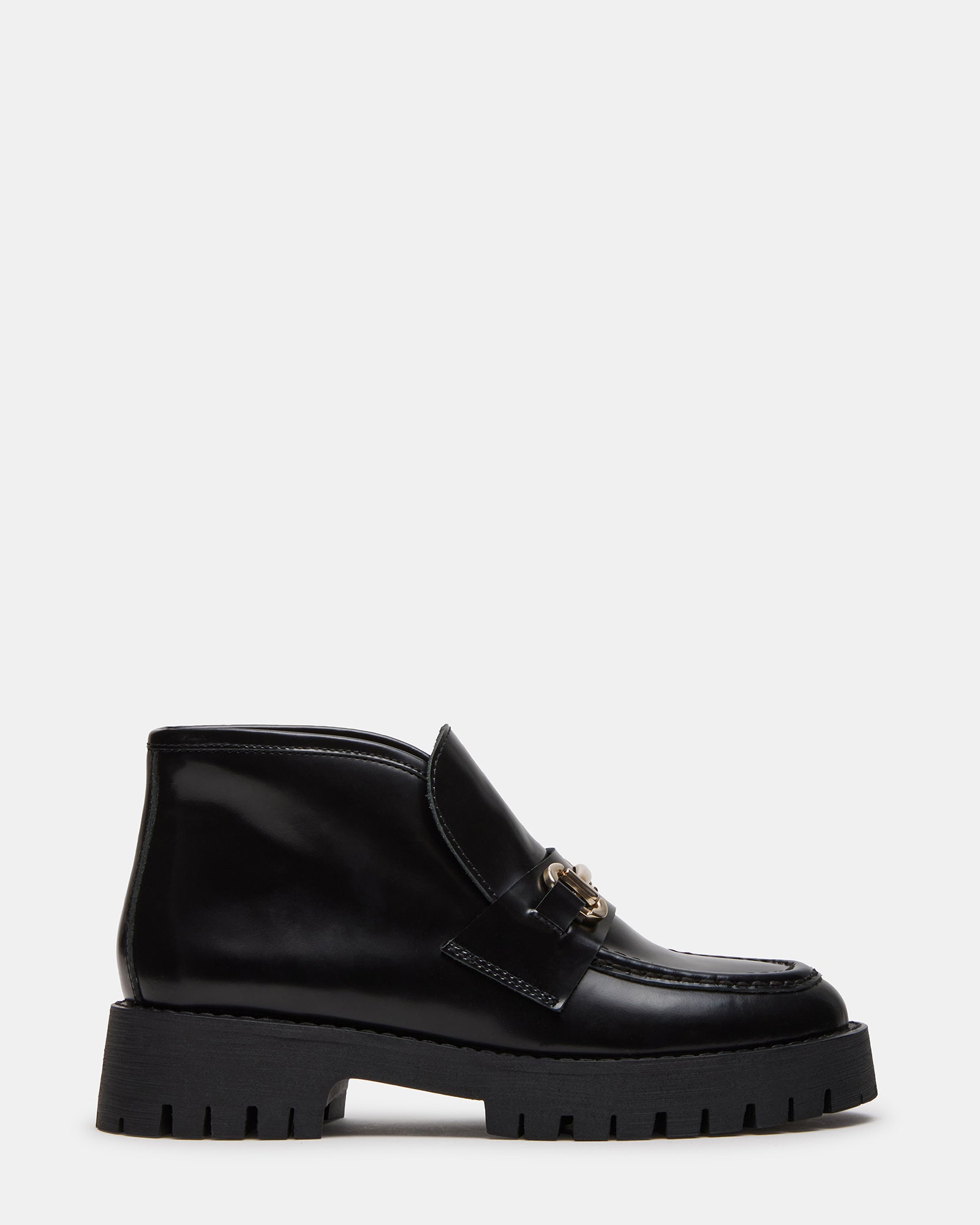 Side view of LEON black platform loafers showing sleek horsebit hardware and lug sole