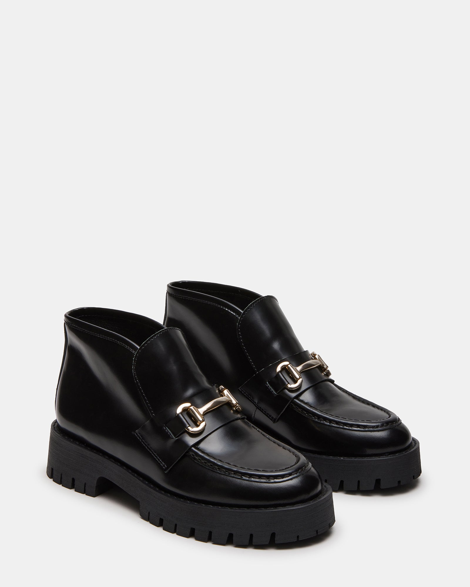 Top-down shot of womens suede loafers with platform heel and modern design