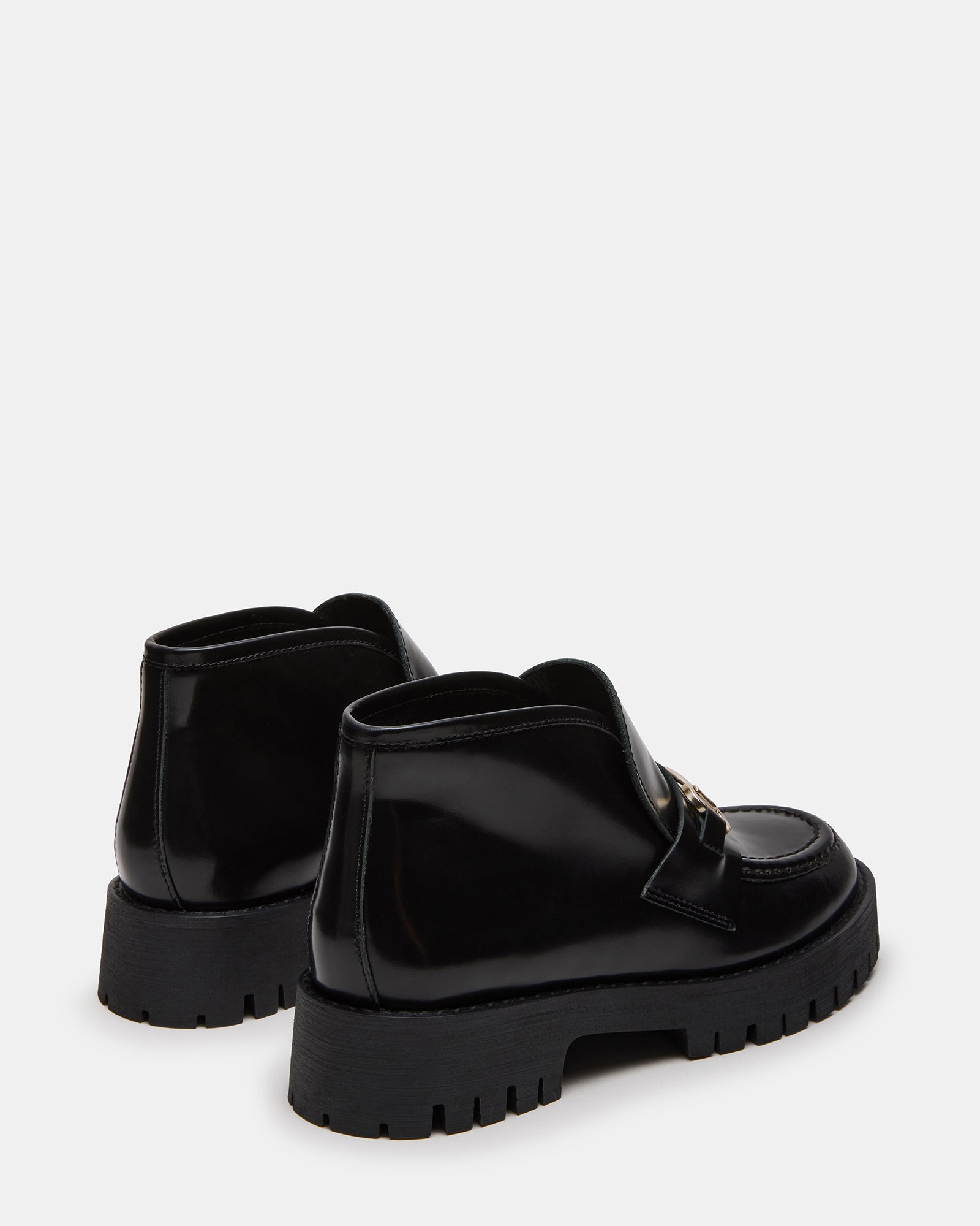 Top-down shot of womens suede loafers with platform heel and modern design